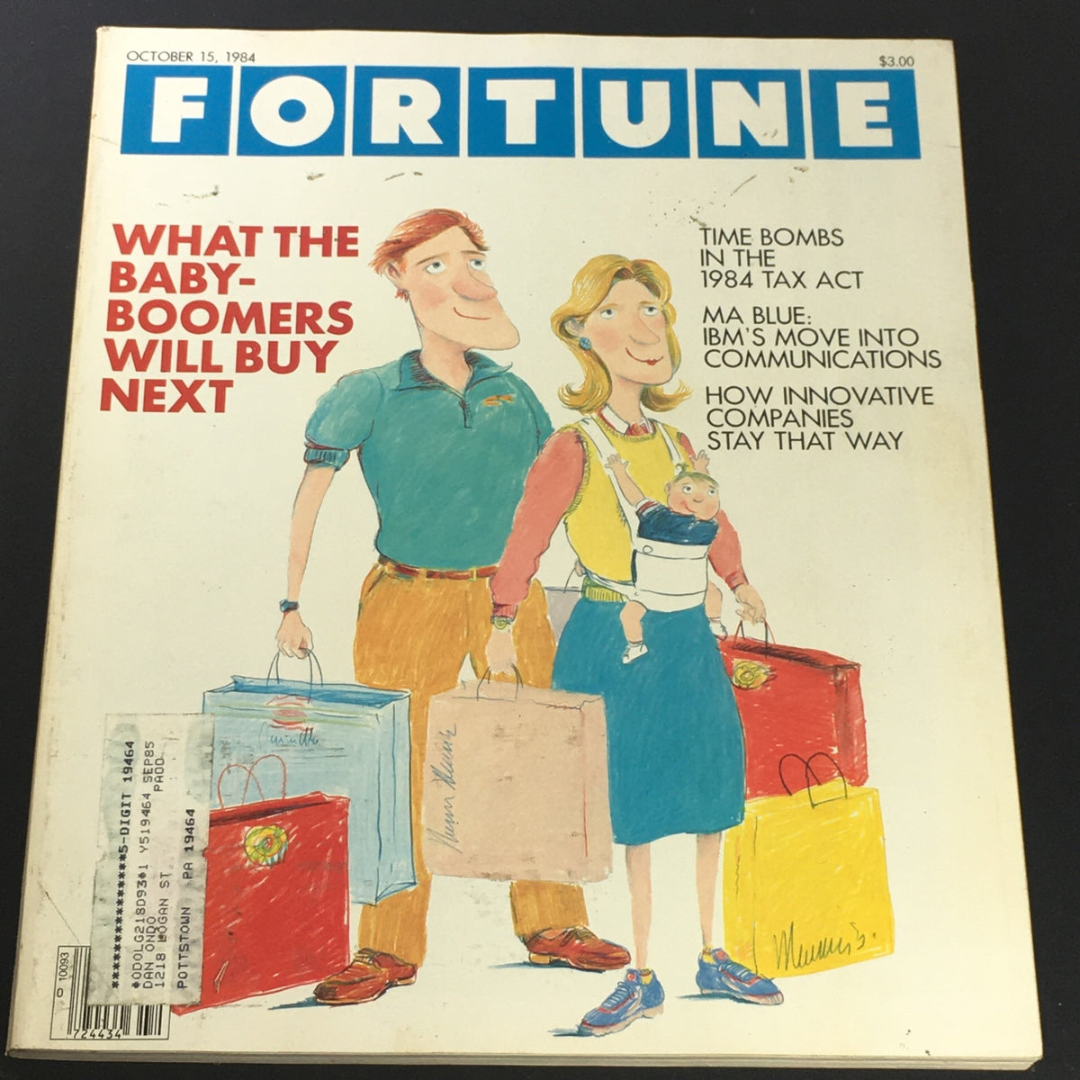 Vintage Fortune Magazine cover from October 15, 1984, featuring the article 'Time Bombs in the 1984 Tax Act', showcasing an illustration of a couple with shopping bags and a child, and highlighting topics such as baby-boomer purchasing trends.