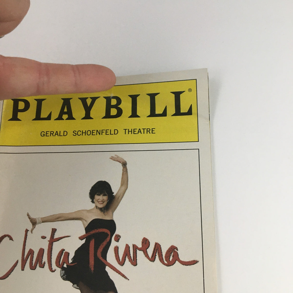 2005 Playbill from the Gerald Schoenfeld Theatre featuring Chita Rivera in The Dancer's Life with a hand pointing at the title.