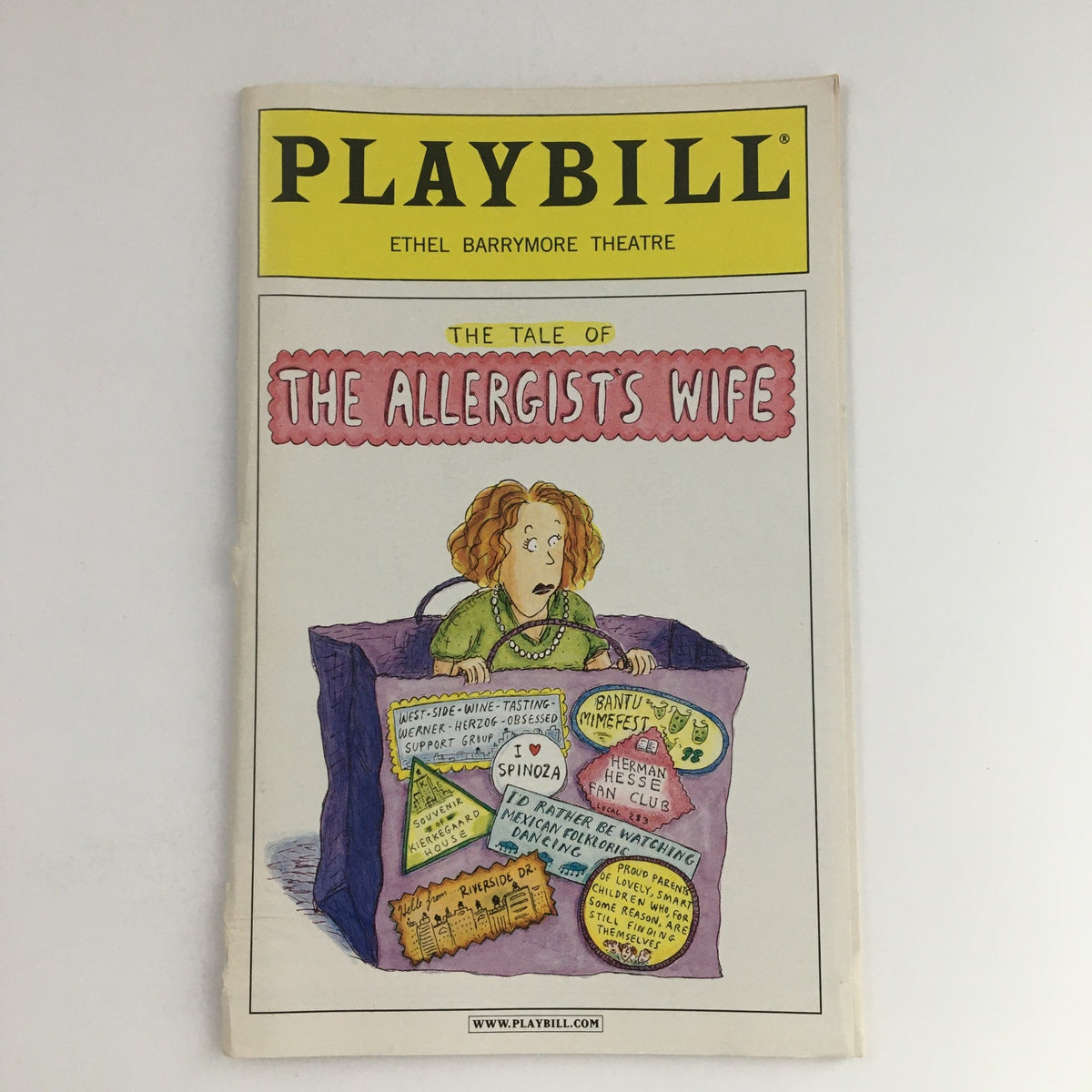 Front cover of the 2000 Playbill for 'The Tale of The Allergist's Wife' at the Ethel Barrymore Theatre, featuring an illustration of a woman in a box with various notices.