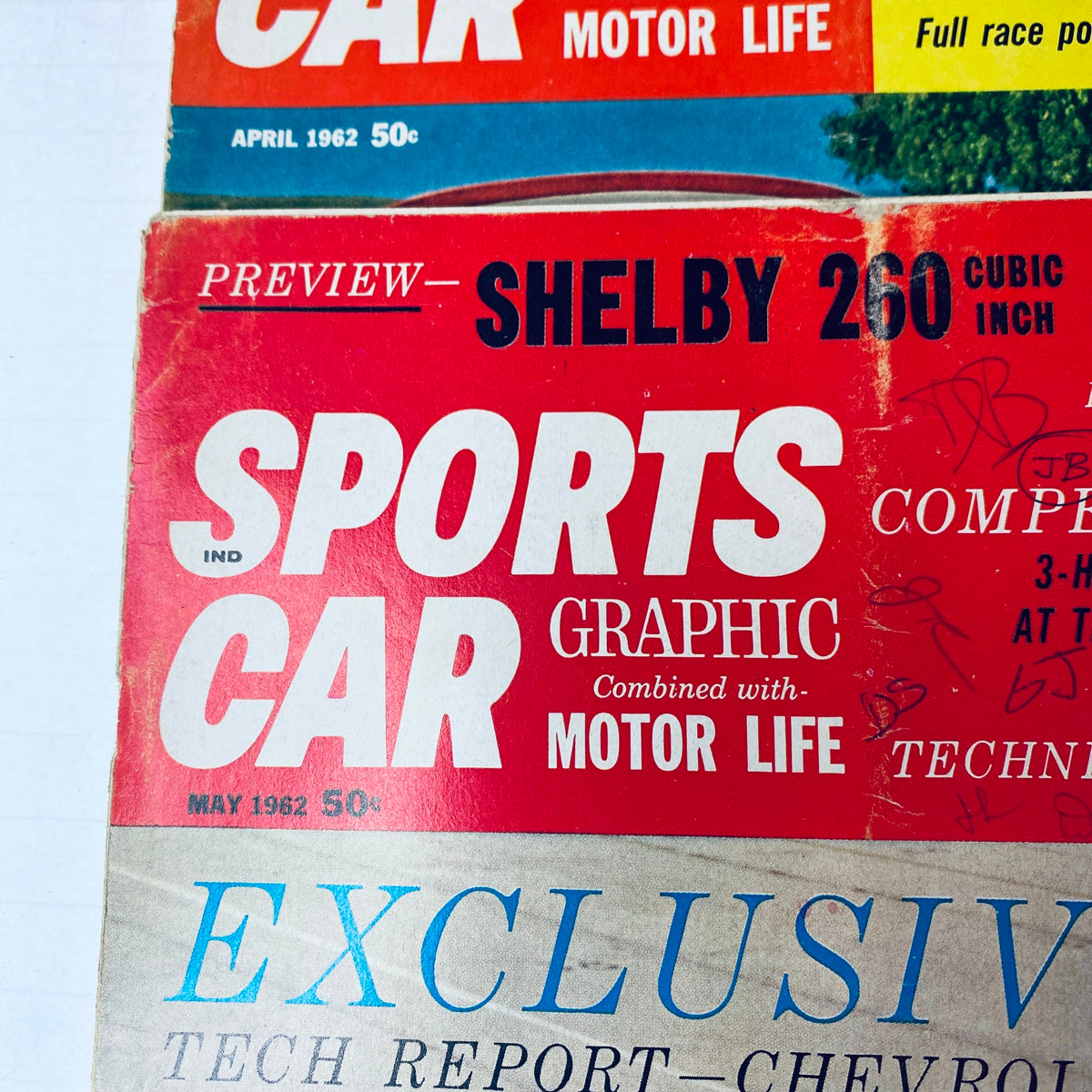 April and May 1962 issues of Sports Car Graphic Magazine, showcasing Shelby 260 and technical reports on various racing vehicles.