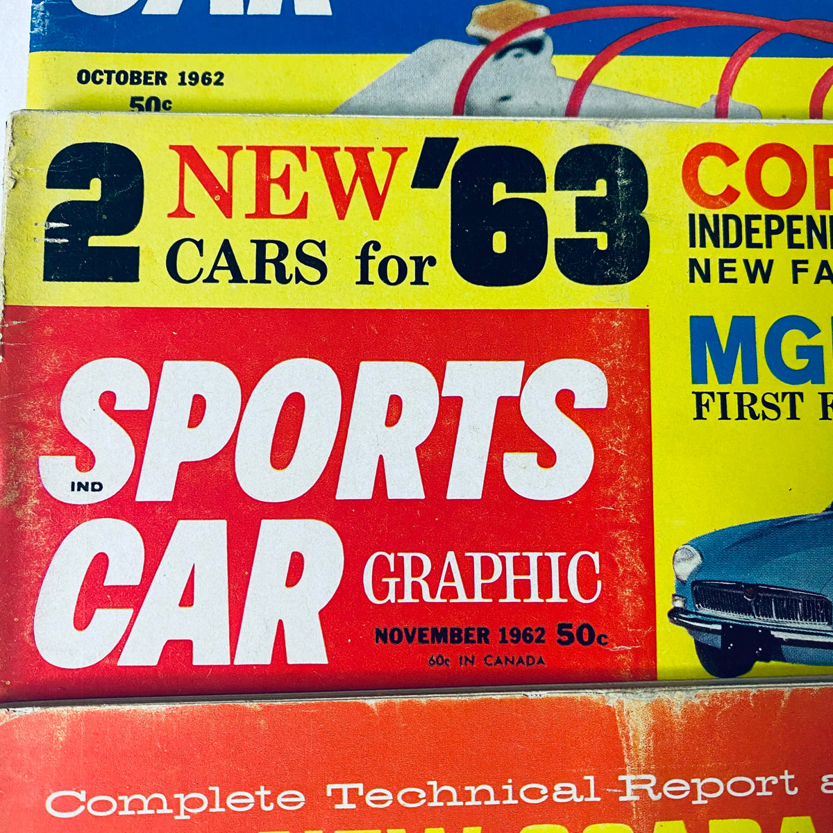 November 1962 edition of Sports Car Graphic Magazine announcing new cars for 1963, alongside technical reports on Corvette and MG.
