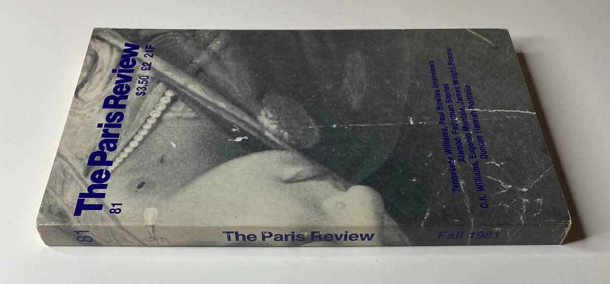 Side view of The Paris Review Magazine Fall 1981 No. 81, showcasing its title and notable content including works by Paul Bowles and Tennessee Williams, with minimal wear.