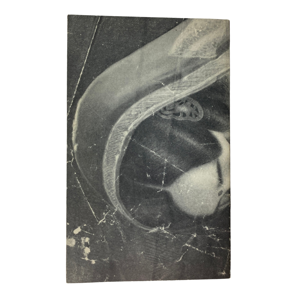 Back cover of The Paris Review magazine showing an artistic abstract photo, with visible wear, representing the magazine's vintage nature.
