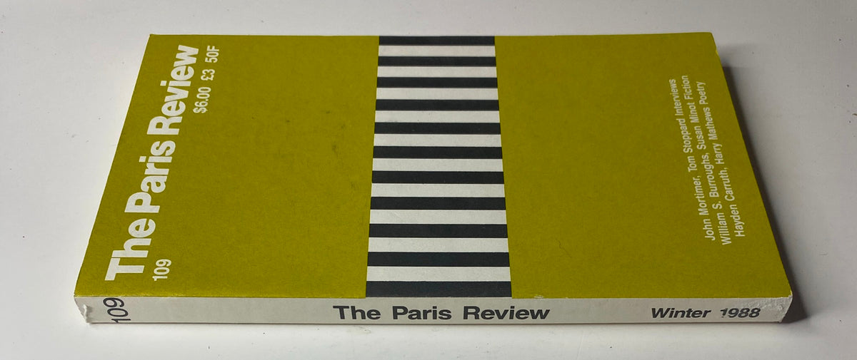 Another view of The Paris Review Magazine Winter 1988 No. 109, showcasing the distinct yellow cover with black stripes, highlighting featured writers and poets like William S. Burroughs and Hayden Carruth.
