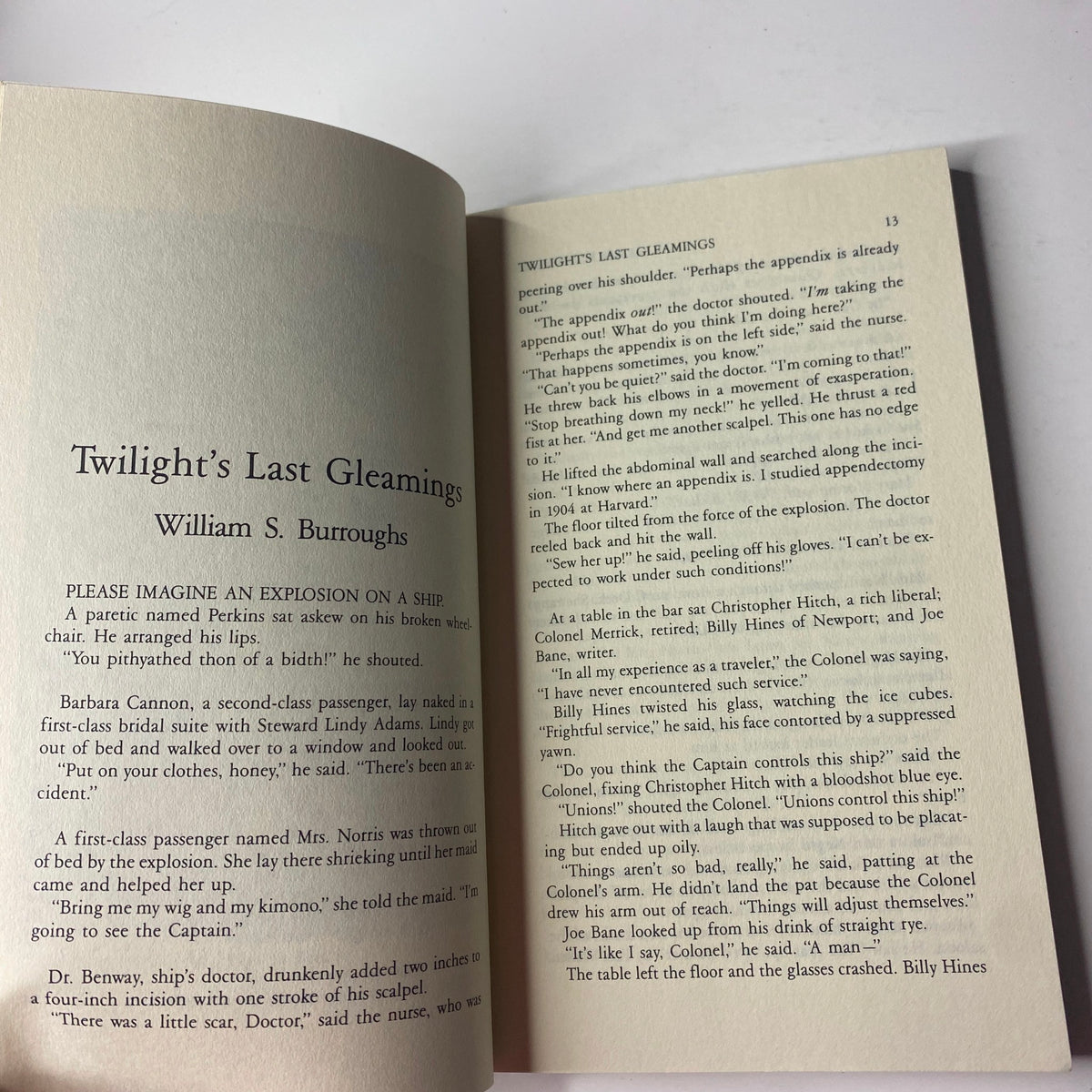 Page from The Paris Review Magazine Winter 1988 No. 109 featuring William S. Burroughs' story 'Twilight’s Last Gleamings'. The text narrates a fictional explosion on a ship, showcasing Burroughs' unique style.