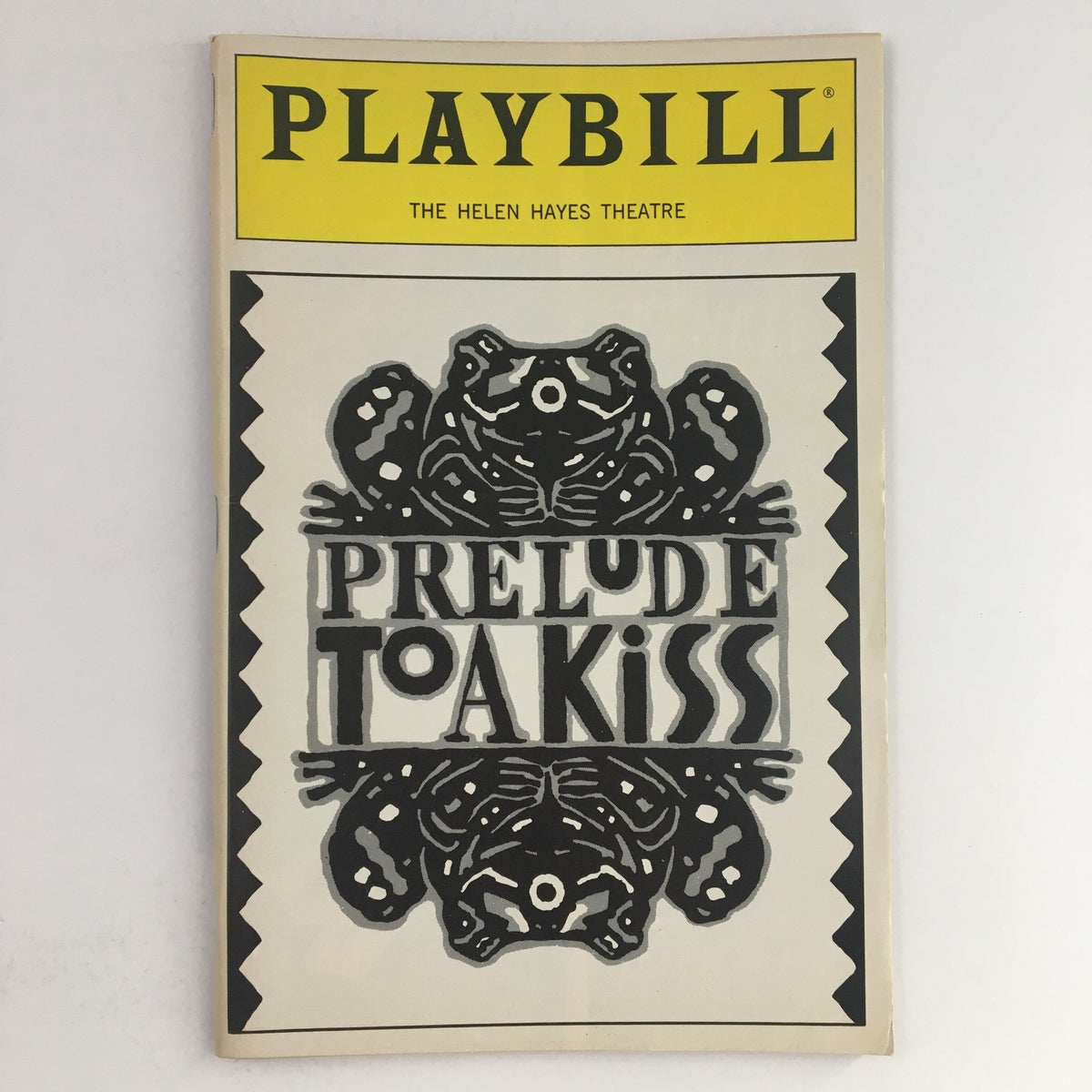 1990 Playbill for Prelude To A Kiss at The Helen Hayes Theatre, featuring whimsical cover art with frogs and decorative elements.