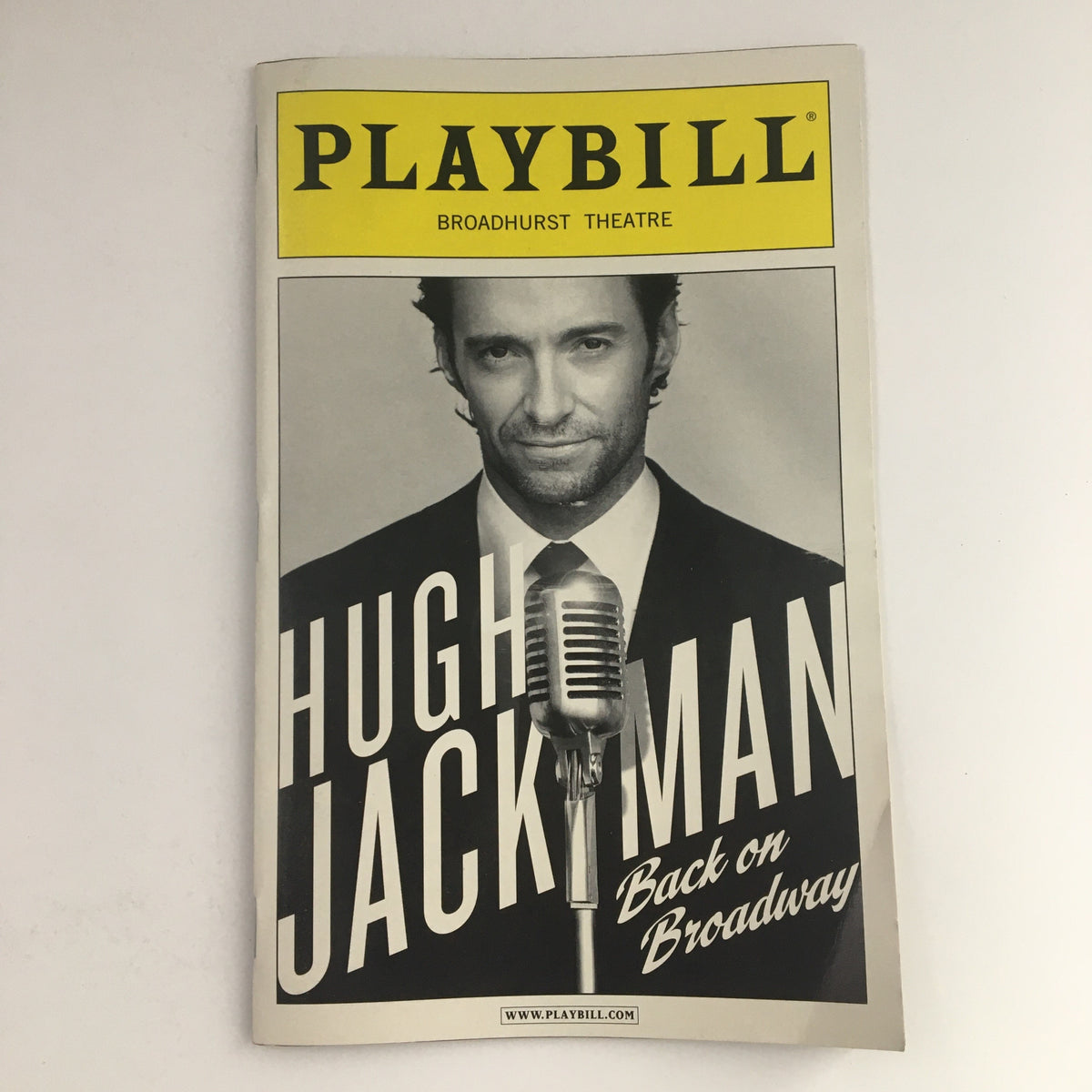 2011 Playbill for Hugh Jackman Back On Broadway at the Broadhurst Theatre featuring a striking cover image of Hugh Jackman with a microphone.