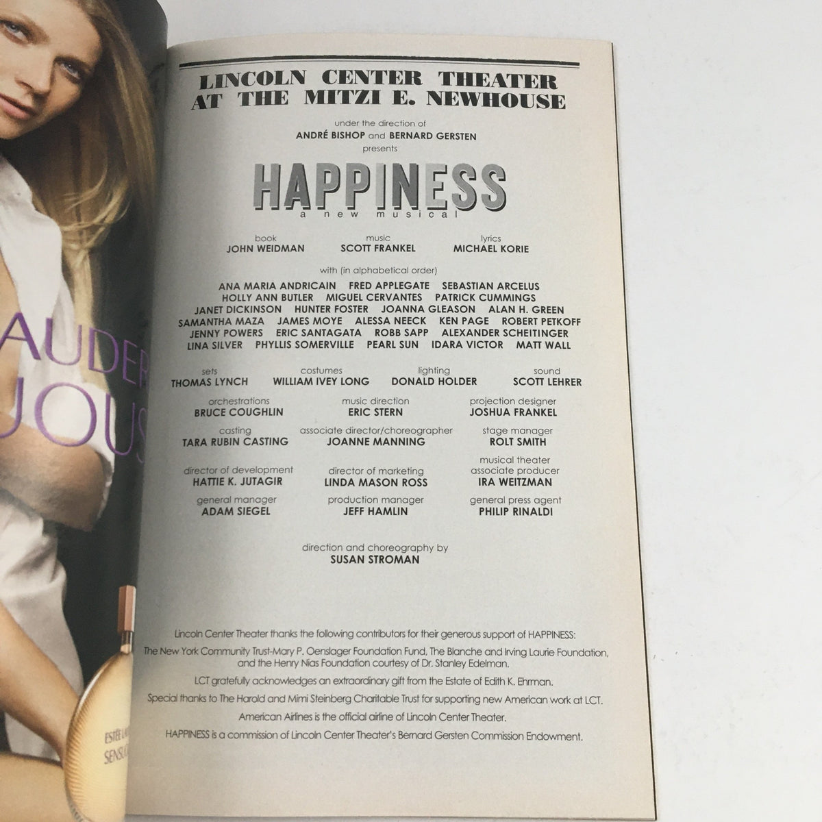 Inside page of the 2009 Playbill for 'Happiness: A Musical' listing the cast and crew at Lincoln Center Theater.