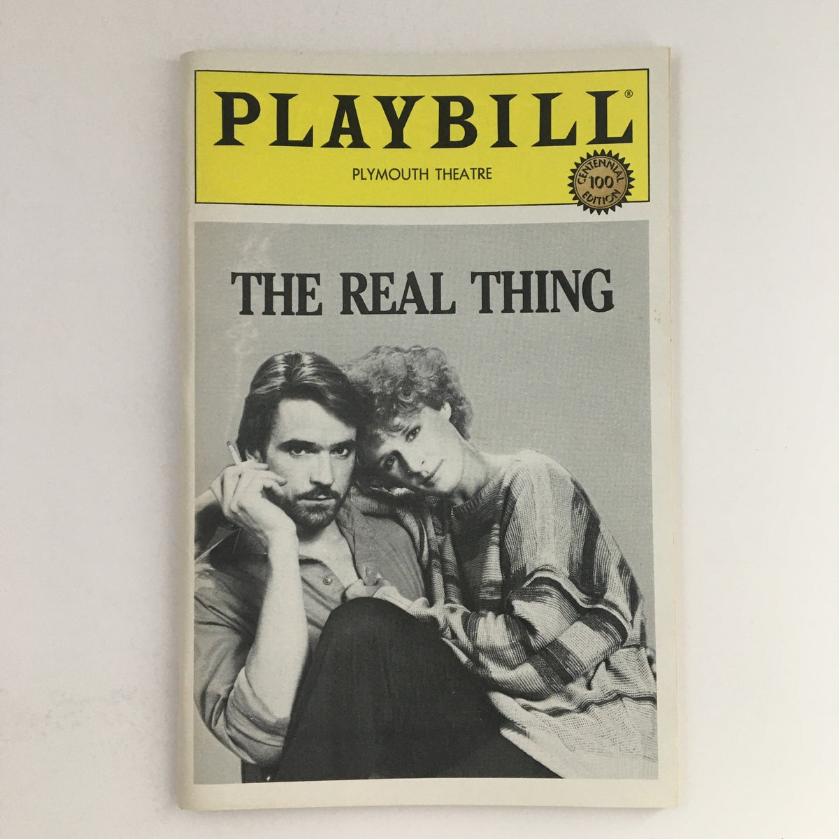 Cover image of the 1984 Playbill for 'The Real Thing' at Plymouth Theatre featuring black and white photography of actors, emblematic of vintage theater memorabilia.