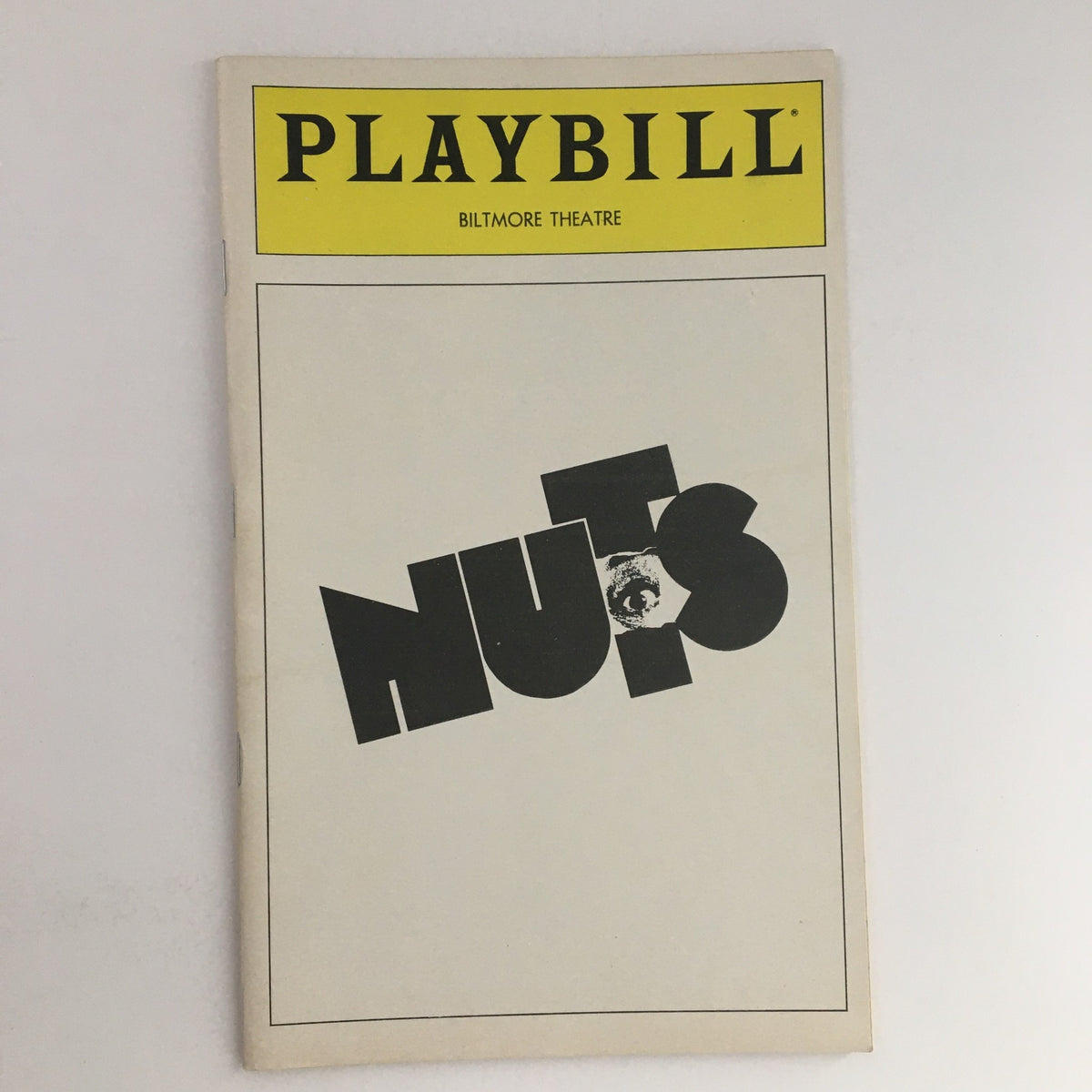 1980 Playbill for 'Nuts' at the Biltmore Theatre, featuring bold black typography and a minimalist design.