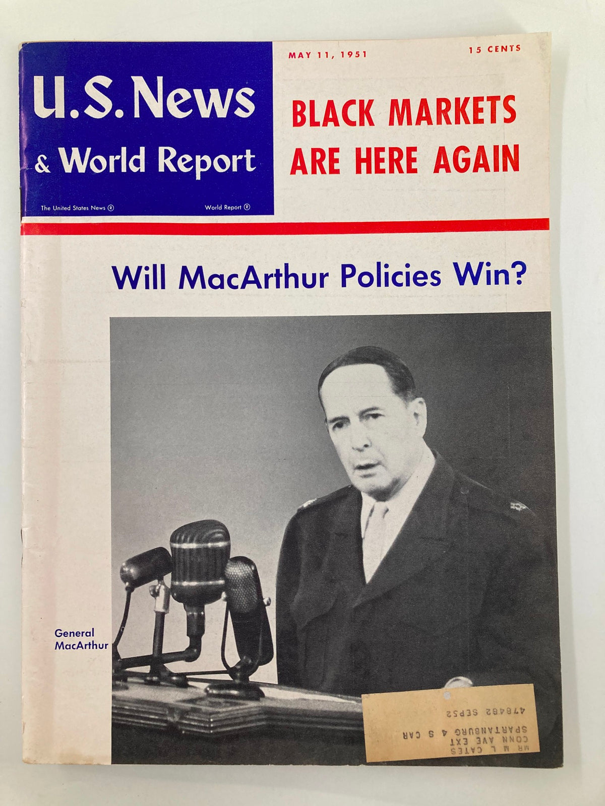 Cover of US News & World Report Magazine dated May 11, 1951, featuring the headline 'Will MacArthur Policies Win?' and showcasing a black and white photograph of General Douglas MacArthur speaking at a podium with microphones.