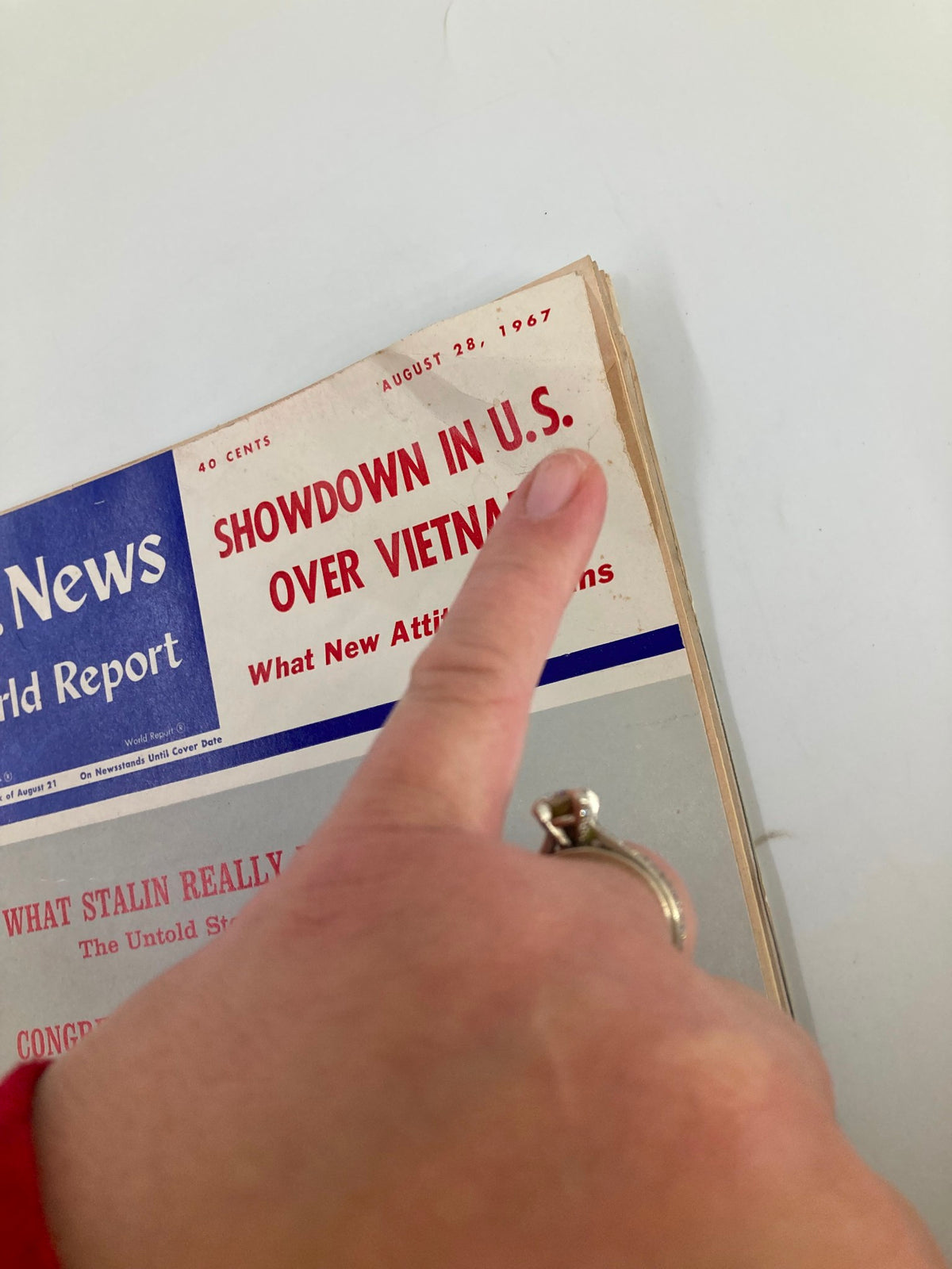Close-up of US News & World Report Magazine August 28 1967 cover showing the title 'Showdown in U.S. Over Vietnam' with a finger pointing to the headline.