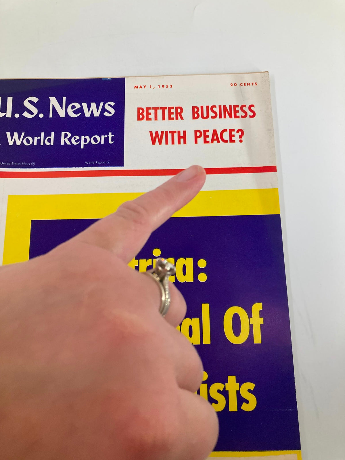 Close-up of the US News & World Report Magazine cover dated May 1, 1953, highlighting the question 'Better Business With Peace?' with a finger pointing at the title.