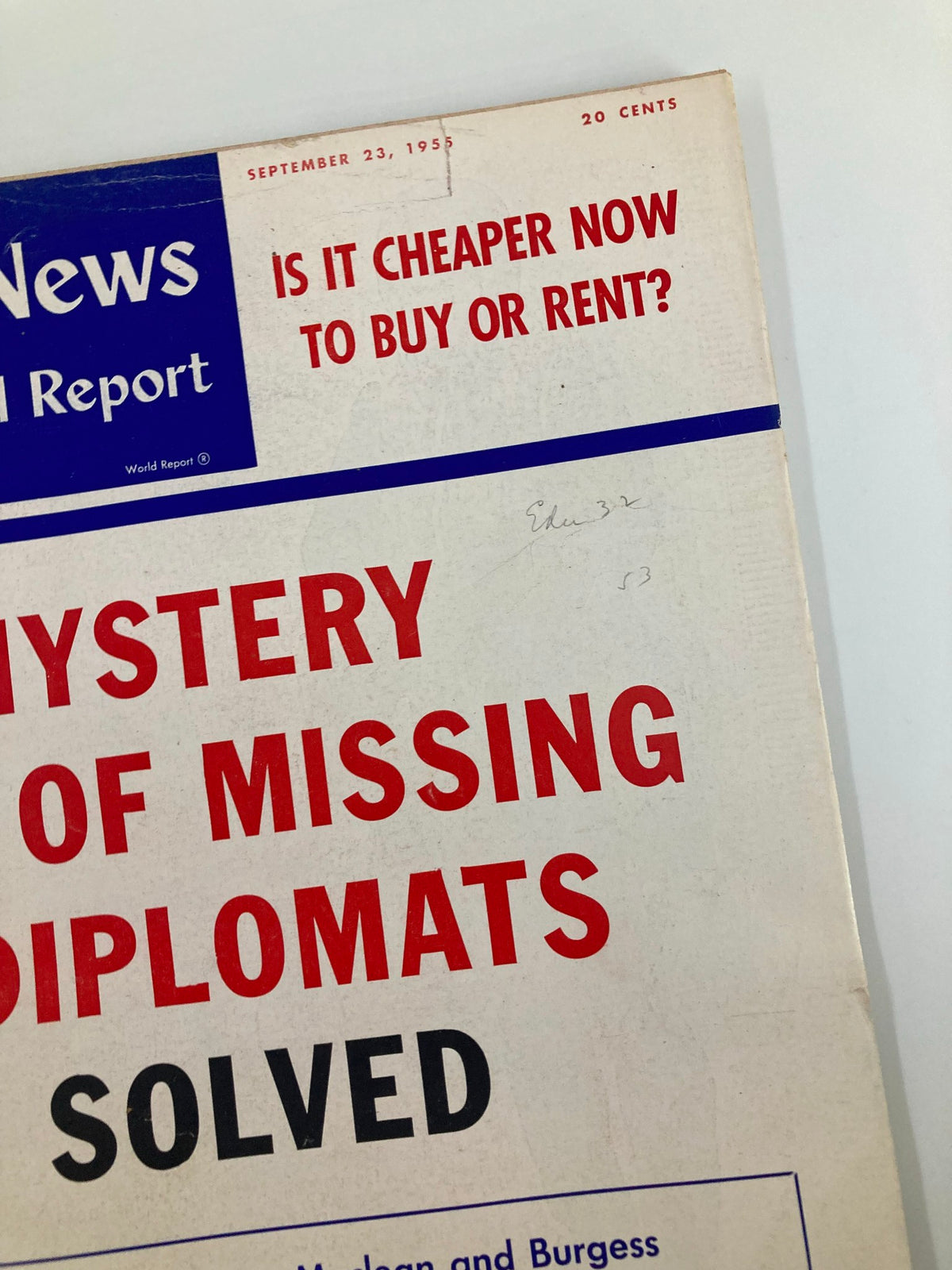 Another angle of the cover of US News & World Report Magazine from September 23, 1955 showcasing the title 'Mystery of Missing Diplomats Solved' and highlighting the magazine's age with visible wear.
