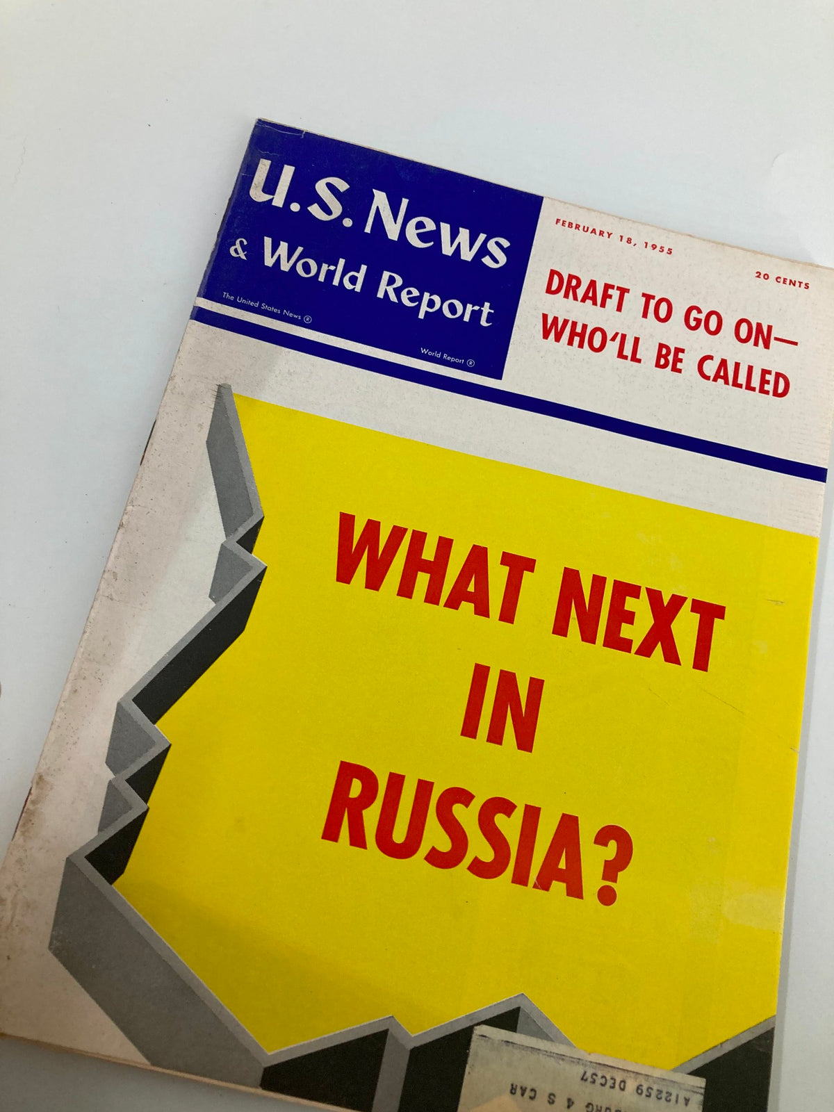 Front cover of US News & World Report magazine dated February 18, 1955, displaying the title 'Draft To Go On - Who'll Be Called?' with a bold graphic highlighting the inquiry 'What Next In Russia?' on a vibrant yellow backdrop.