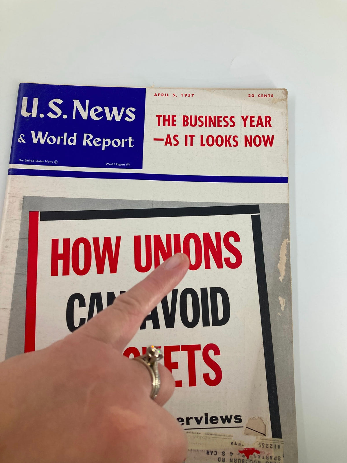 Cover of the US News & World Report Magazine from April 5, 1957, highlighting the article 'How Unions Can Avoid Rackets' with a pointed finger indicating the title.