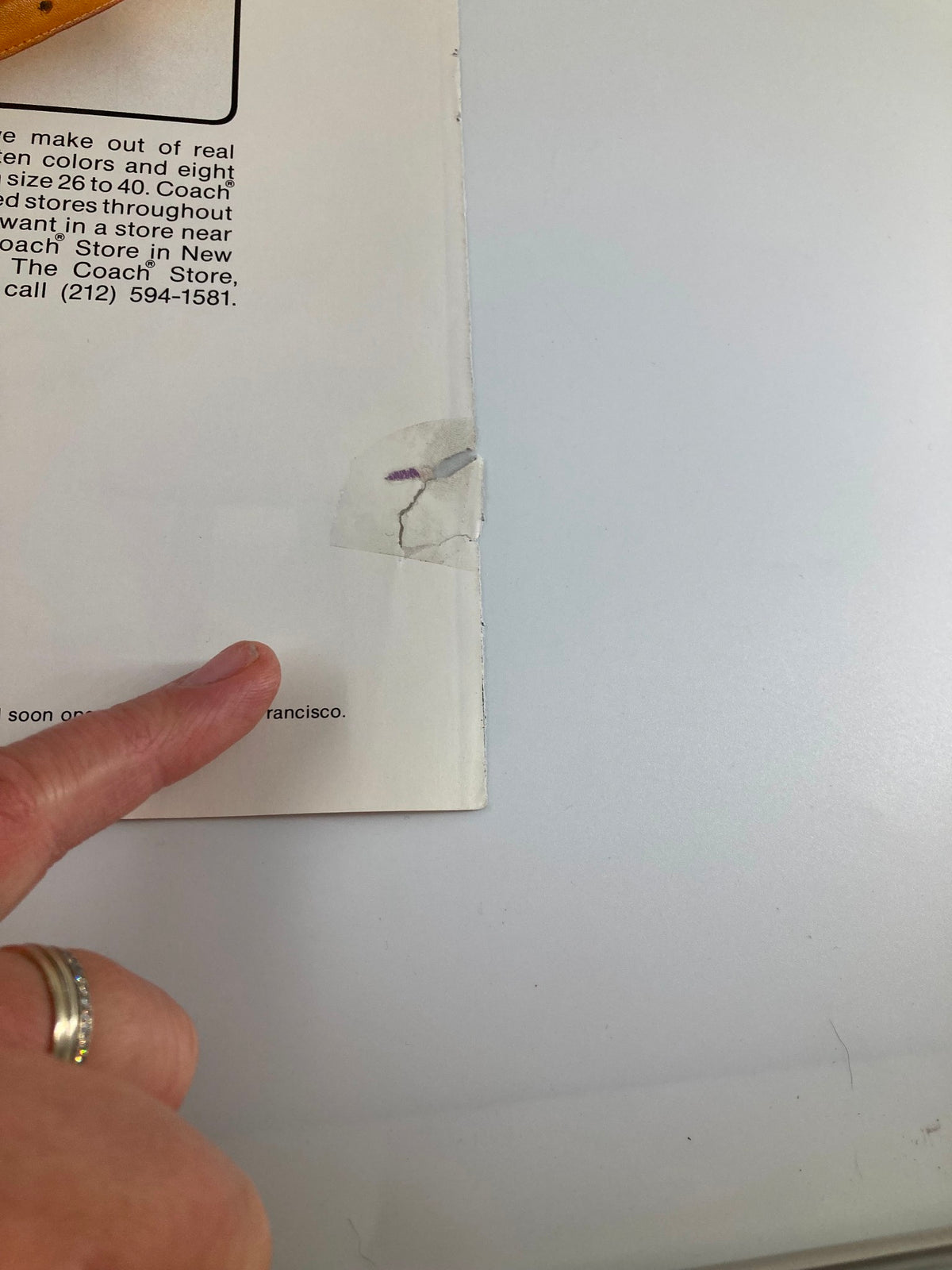 Detail of a small torn label area on the back of the COVER ONLY The New Yorker April 4 1983 Bunny Family by Chas Addams magazine cover, highlighting the wear and history of the item.
