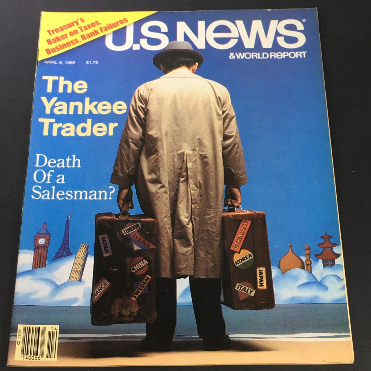 US News & World Report April 8 1985 cover featuring 'The Yankee Trader' with a man in a trench coat holding two suitcases, exploring themes of international trade and the economy.