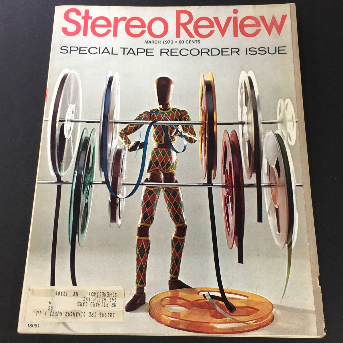 Cover of the VTG Stereo Review Music Magazine March 1973 - Special Tape Recorder Issue featuring a colorful representation of a mannequin surrounded by audio tape reels, highlighting advancements in audio technology from the 1970s.