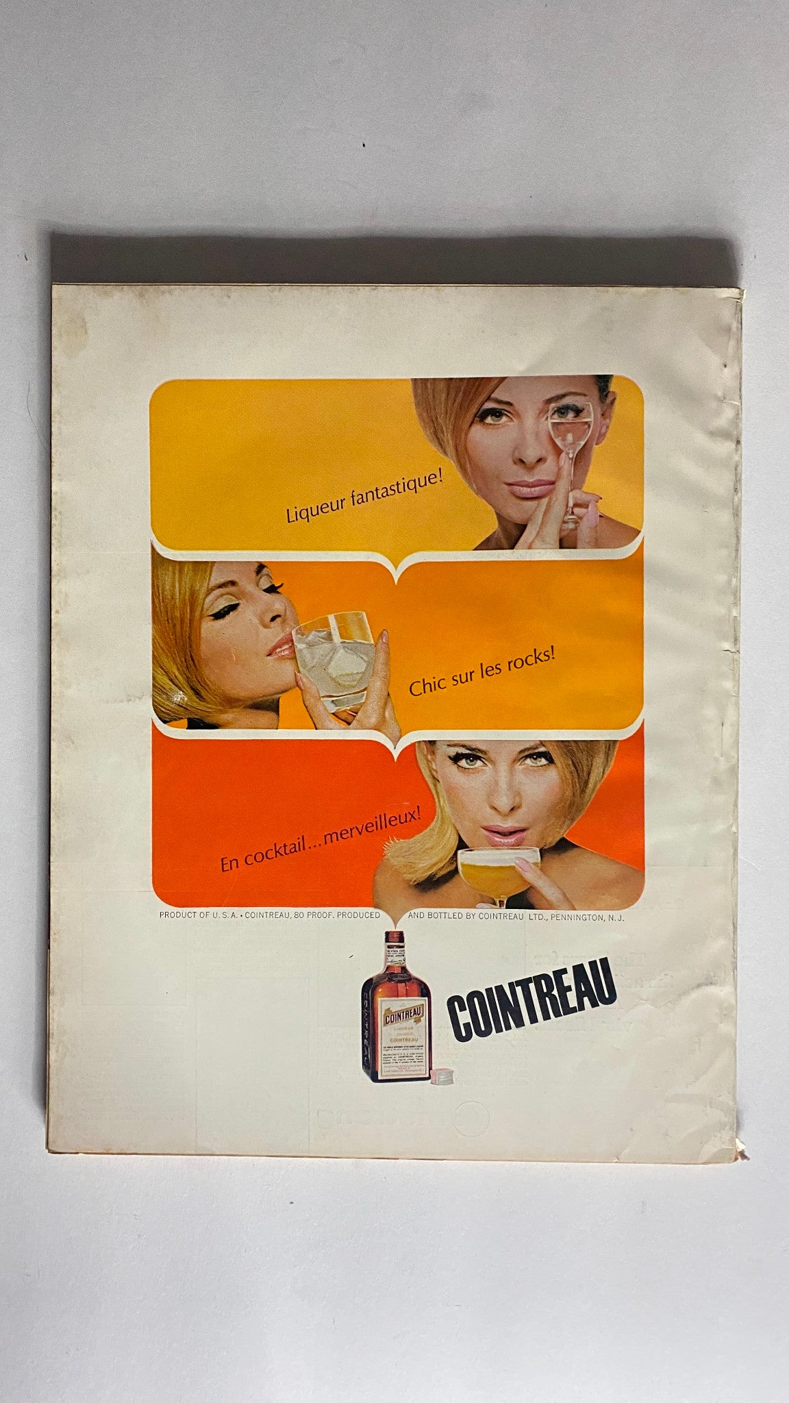 Back cover of the VTG House Beautiful Magazine December 1966, advertising Cointreau liqueur with vibrant graphics and models.