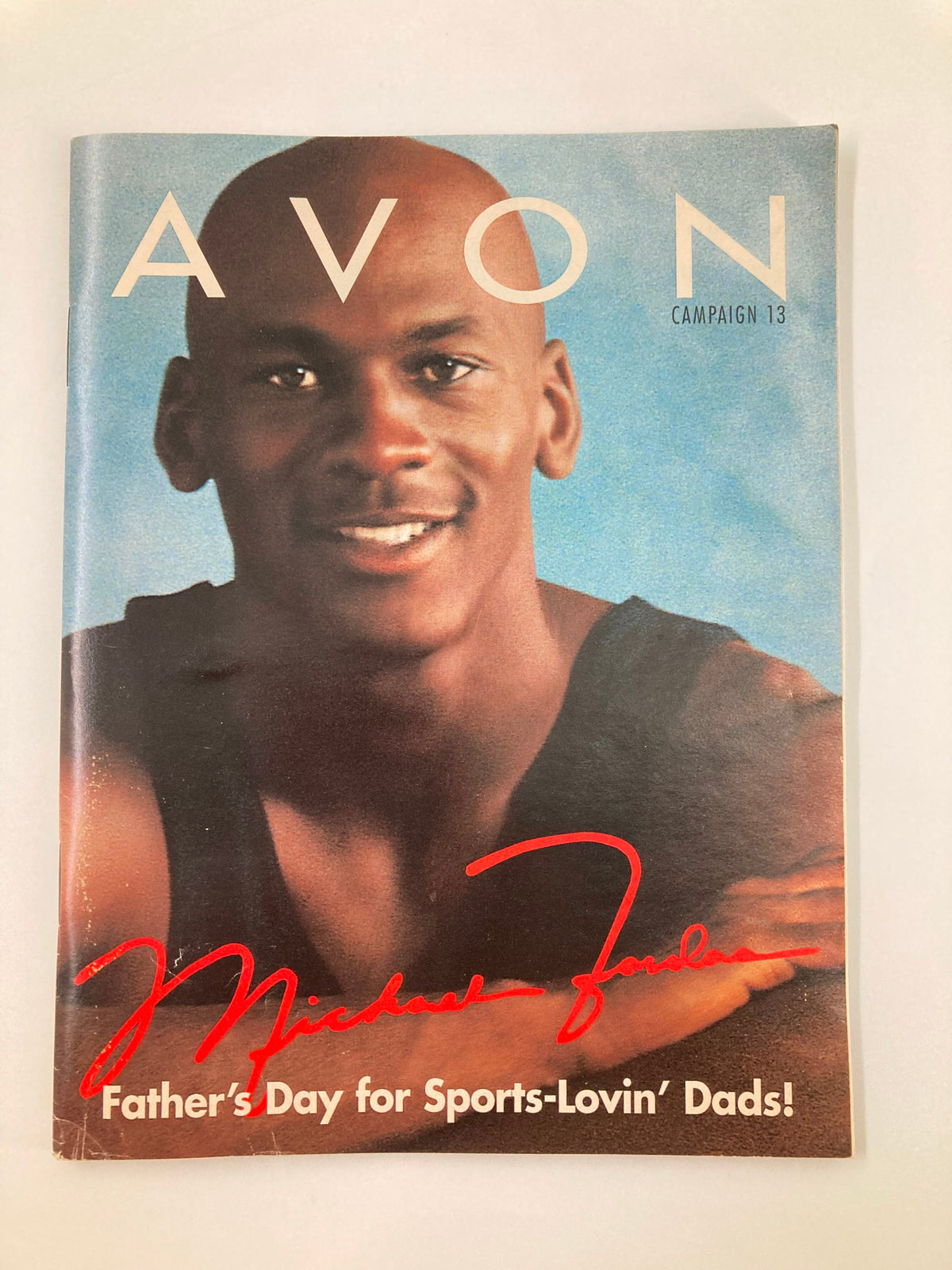 1997 Avon Campaign 13 Brochure featuring Michael Jordan, celebrating Father's Day with vibrant cover design and signature, ideal for vintage magazine collectors.