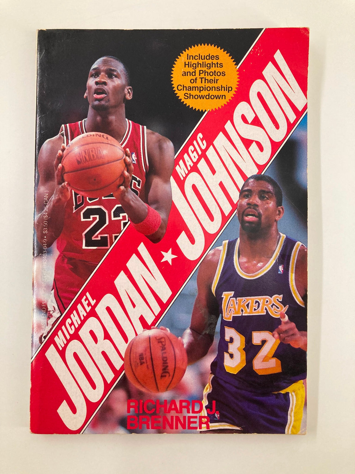 Cover of the 1991 book 'Superstars Michael Jordan and Magic Johnson' by Richard J. Brenner, featuring images of Michael Jordan in a Chicago Bulls jersey and Magic Johnson in a Los Angeles Lakers jersey, showcasing highlights and photos of their championship showdown.