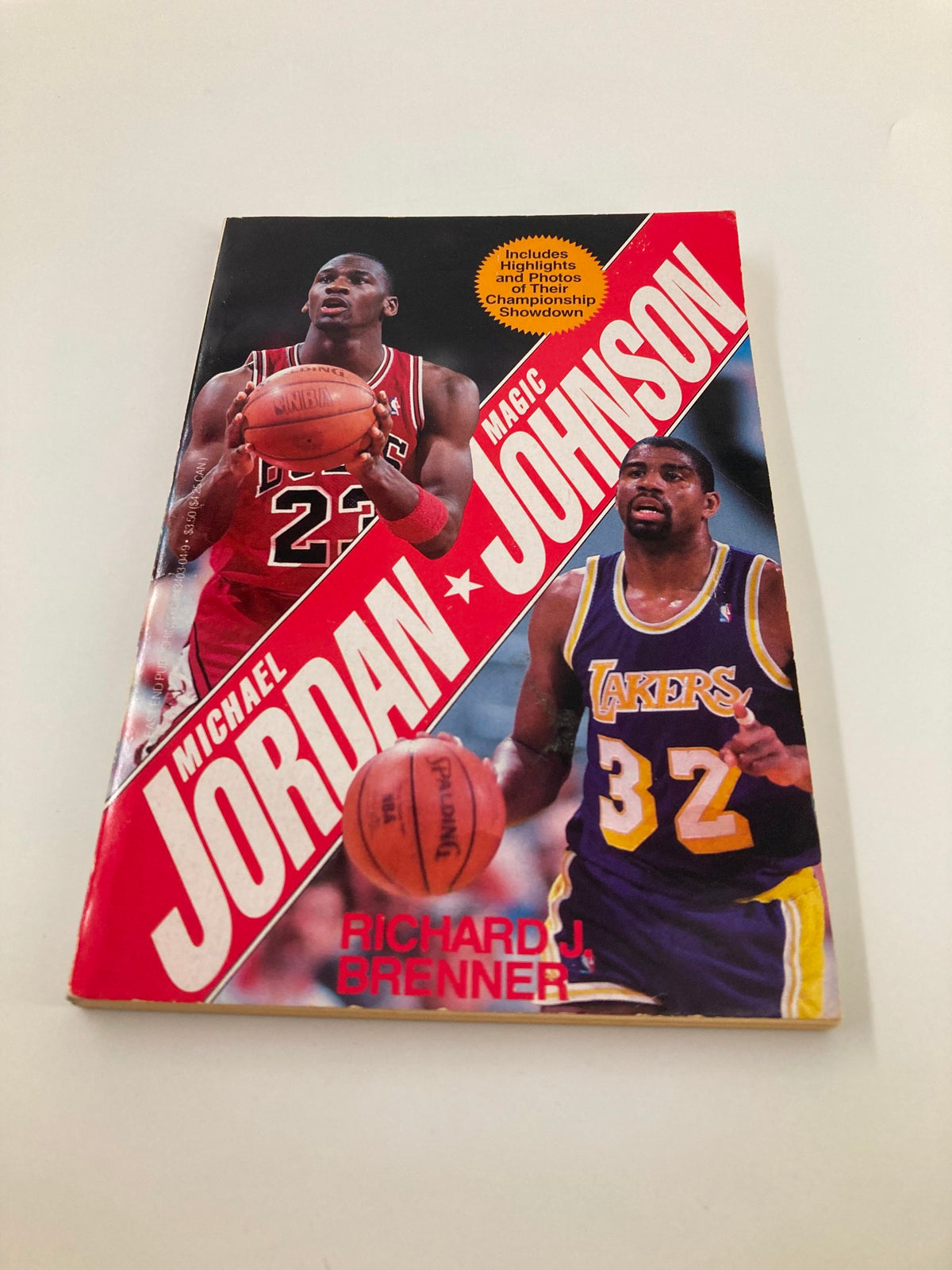 Cover of the 1991 book 'Superstars Michael Jordan and Magic Johnson' by Richard J. Brenner, highlighting Michael Jordan and Magic Johnson with basketballs, emphasizing their rivalry and significant moments in basketball history.