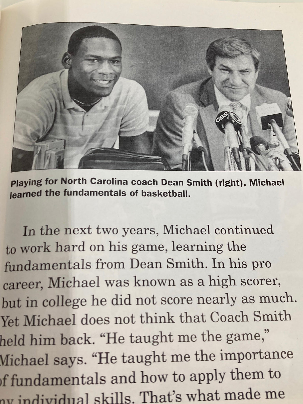 Image of a young Michael Jordan during a press conference with coach Dean Smith in '1995 Sports Stars Michael Jordan Beyond Air Book by Philip Brooks'.