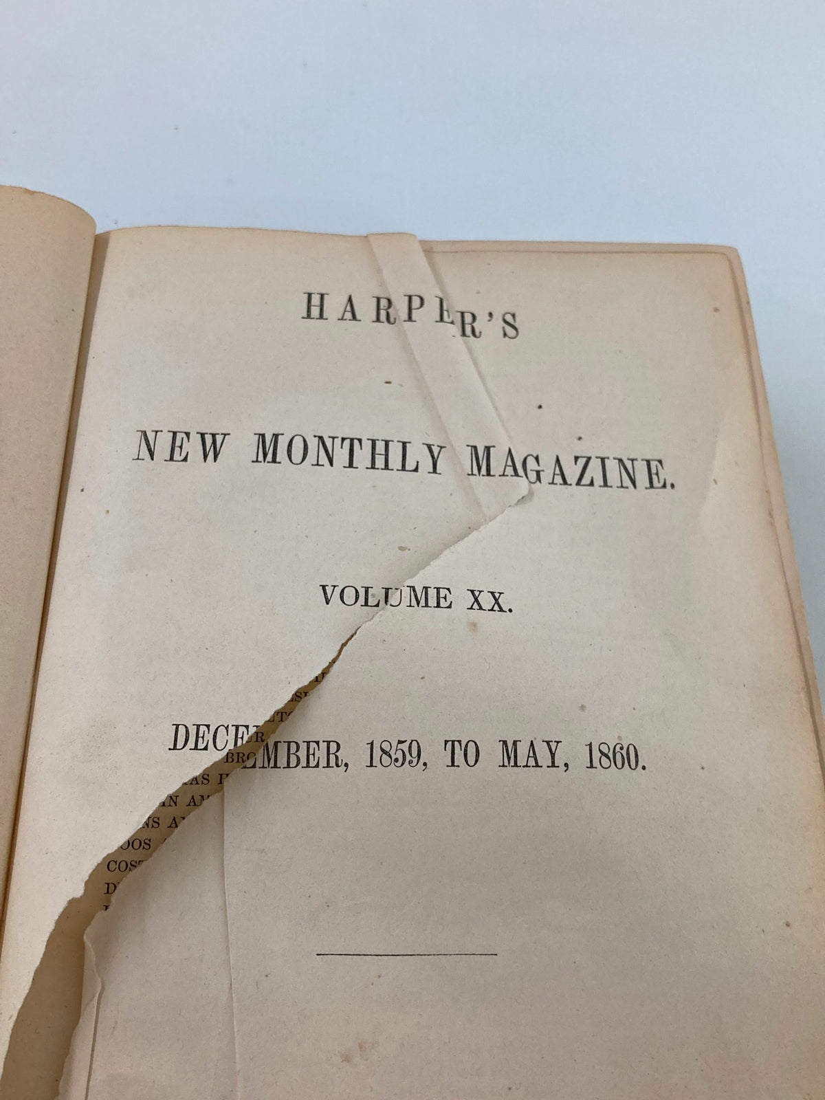 Interior view of VTG Harper's New Monthly Magazine Volume XX, revealing the title page dated December 1859 to May 1860, showcasing vintage typography and paper detailing.