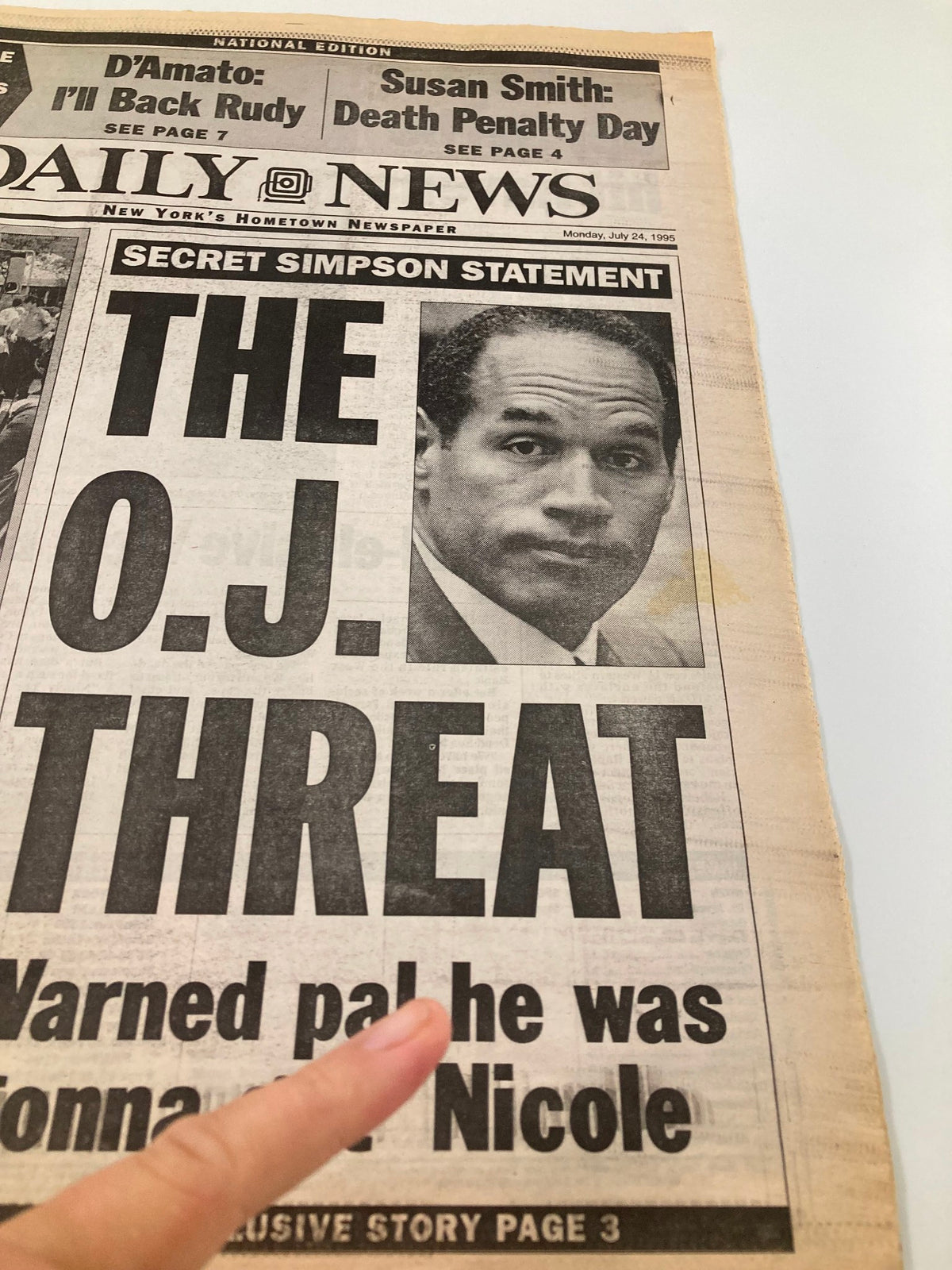 Detailed view of the Daily News Newspaper July 24 1995 cover, highlighting the article 'THE O.J. THREAT.' The image captures the impactful headline and a close-up of O.J. Simpson, emphasizing the newspaper's importance in sports culture.