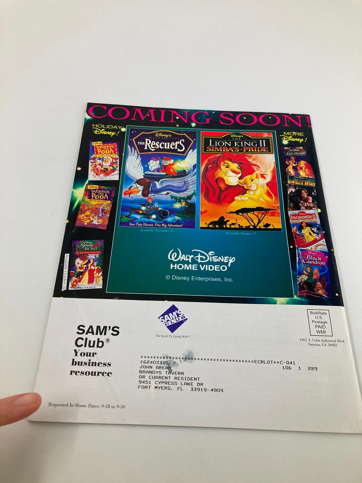 Back cover of Sam's Club Source Magazine, October 1998, Vol 1 #1, showcasing promotional Disney home video releases, part of the magazine's content on business resources.