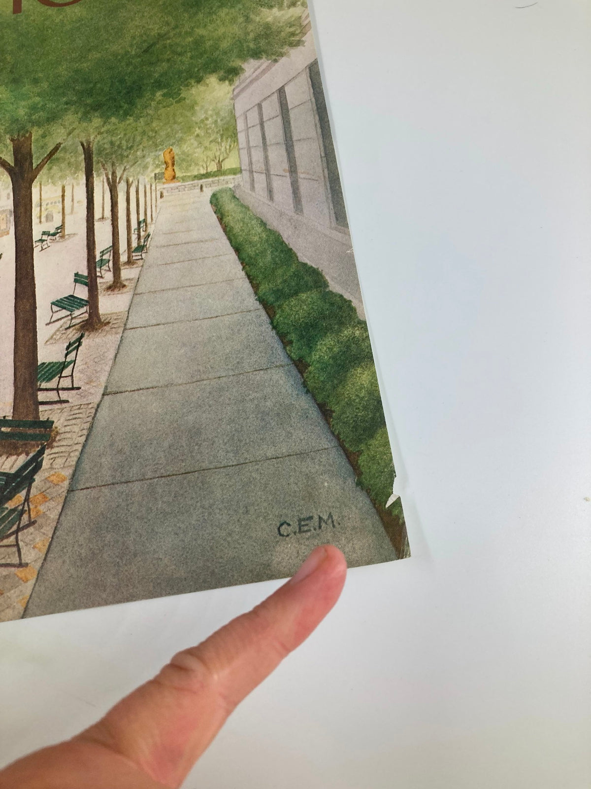 Detail of The New Yorker cover from September 19, 1983, 'Empty Chairs' by Charles E. Martin, highlighting the artist's signature C.E.M. near the edge of the cover.