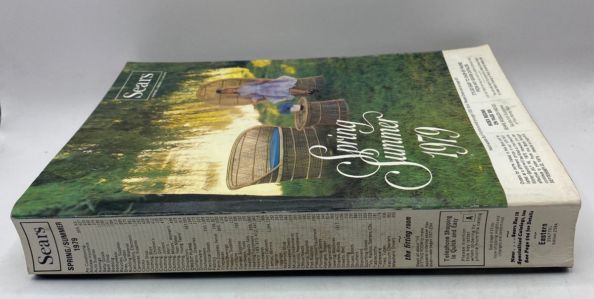 Side view of the 1979 Sears Spring Summer Where America Shops Catalog, showing its spine and the summer theme with greenery in the background.