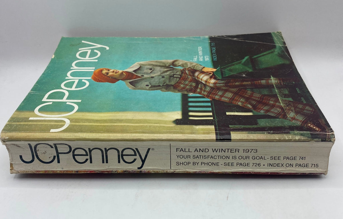 Side view of the 1973 JCPenney Fall and Winter All in Layers Catalog highlighting its spine and detailing, ideal for vintage catalog collectors.
