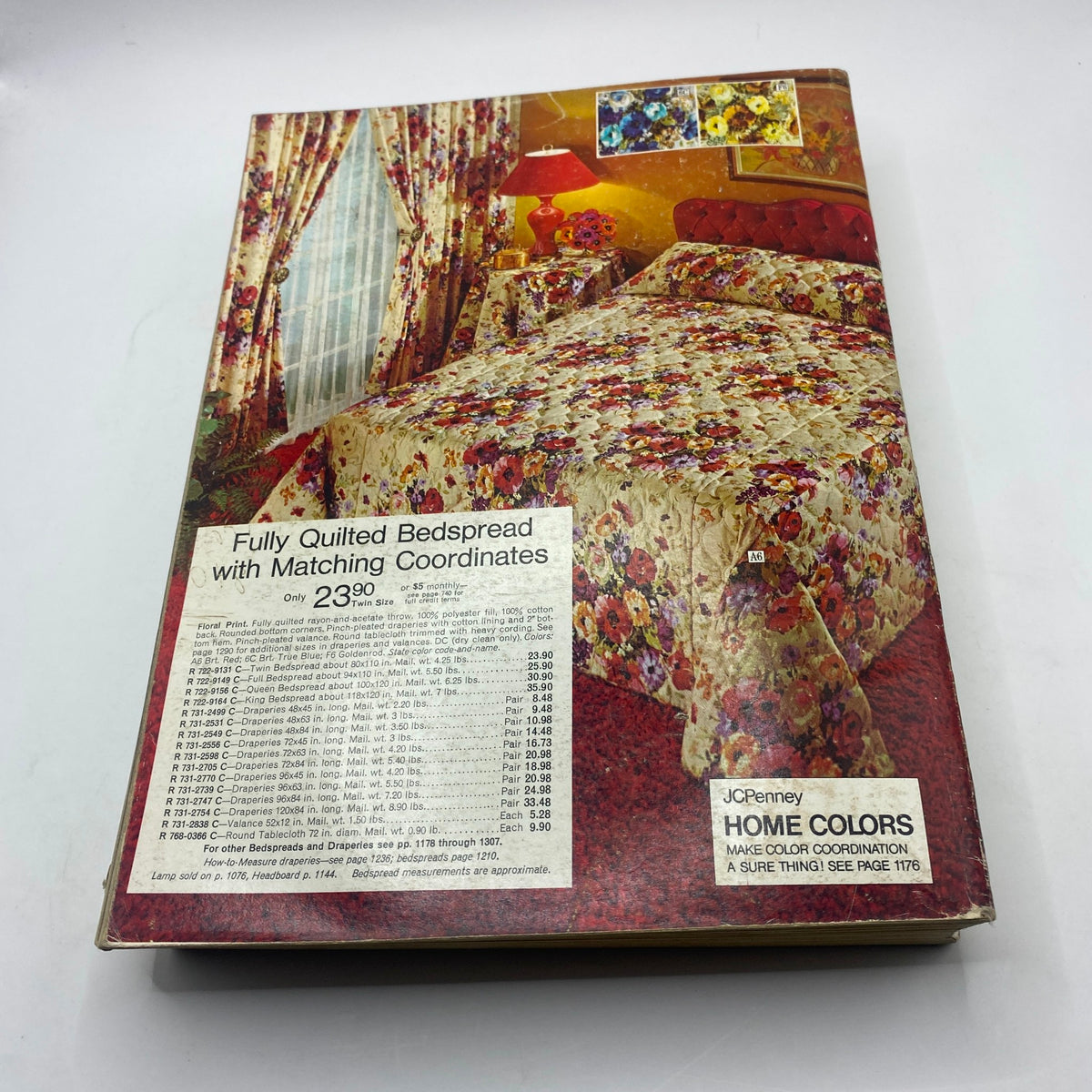 Cover of the 1973 JCPenney Fall and Winter All in Layers Catalog featuring a floral fully quilted bedspread and matching curtains, showcasing vibrant colors and home décor options.