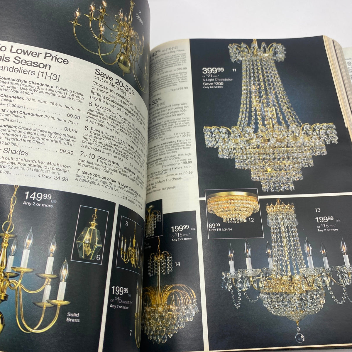 1994 JCPenney Spring and Summer Catalog displaying an array of chandeliers with pricing details, including stylish crystal and brass options available during the sale.