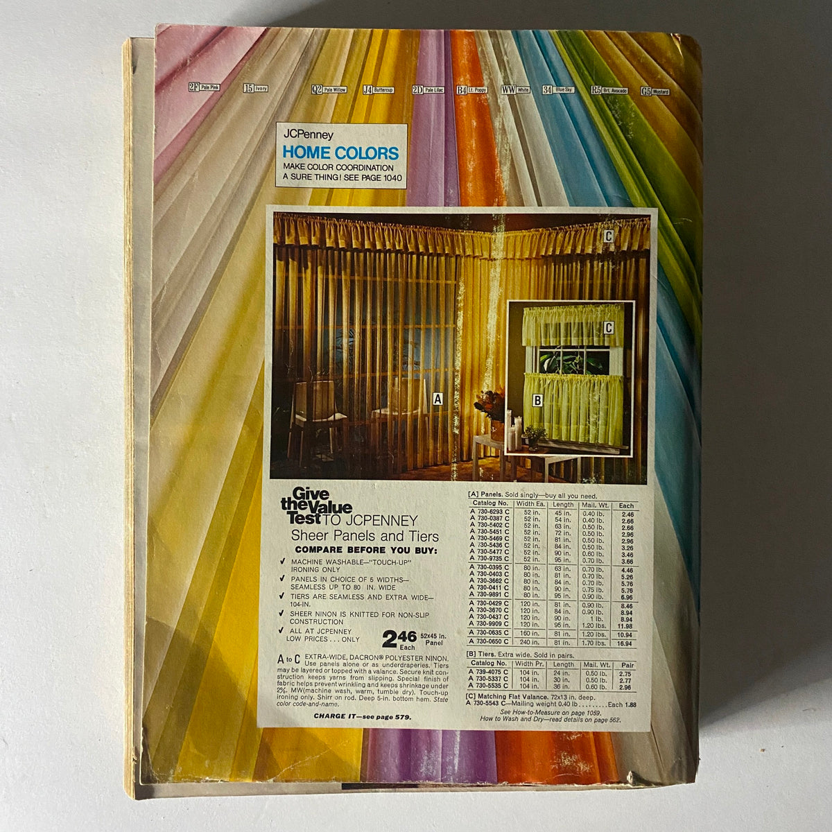 1974 JCPenney Spring and Summer Catalog cover showcasing colorful sheer panels and tiles in an interior setting, emphasizing home décor options.