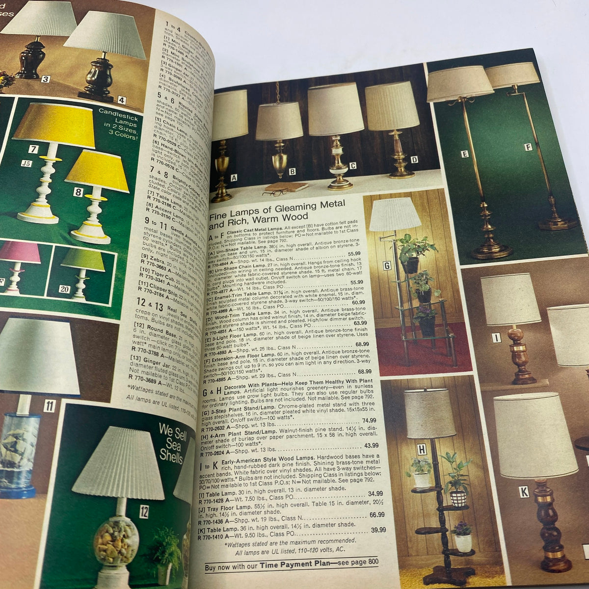Image from the 1977 JCPenney Fall and Winter Catalog displaying a variety of elegant lamps made from gleaming metal and rich wood, perfect for home decor.