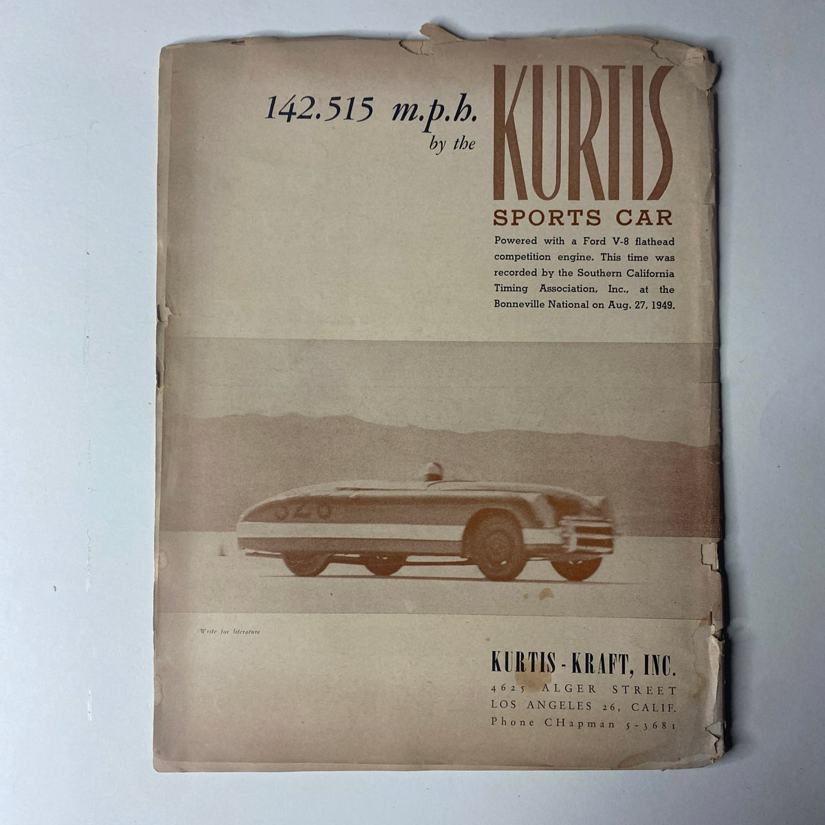 Cover page of Motor Trend Magazine October 1949 emphasizing the Kurtis Sports Car, showcasing its top speed and design, along with associated marketing details.