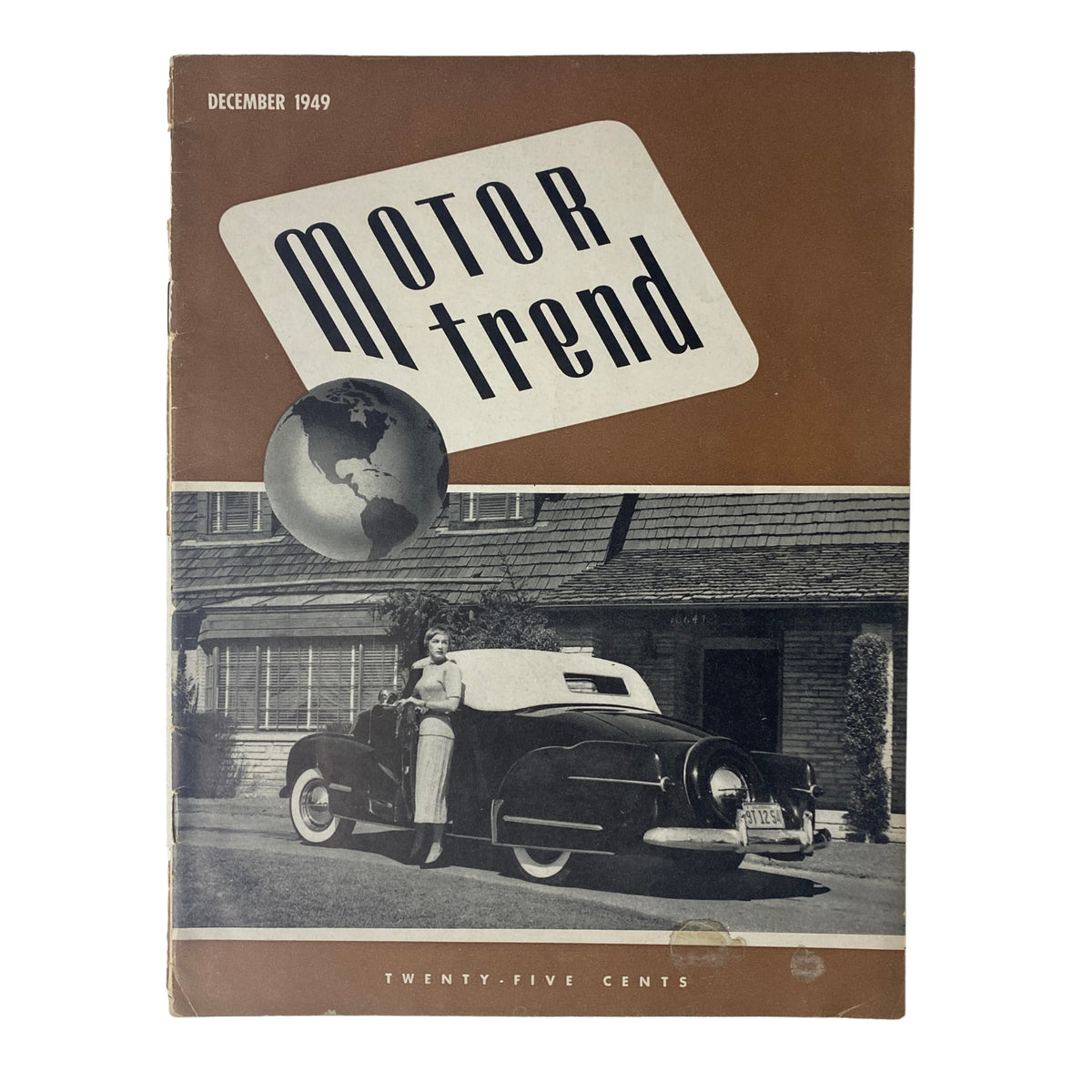 Motor Trend Magazine December 1949 featuring Phyllis Avedon cover, showcasing a vintage car and a globe motif.