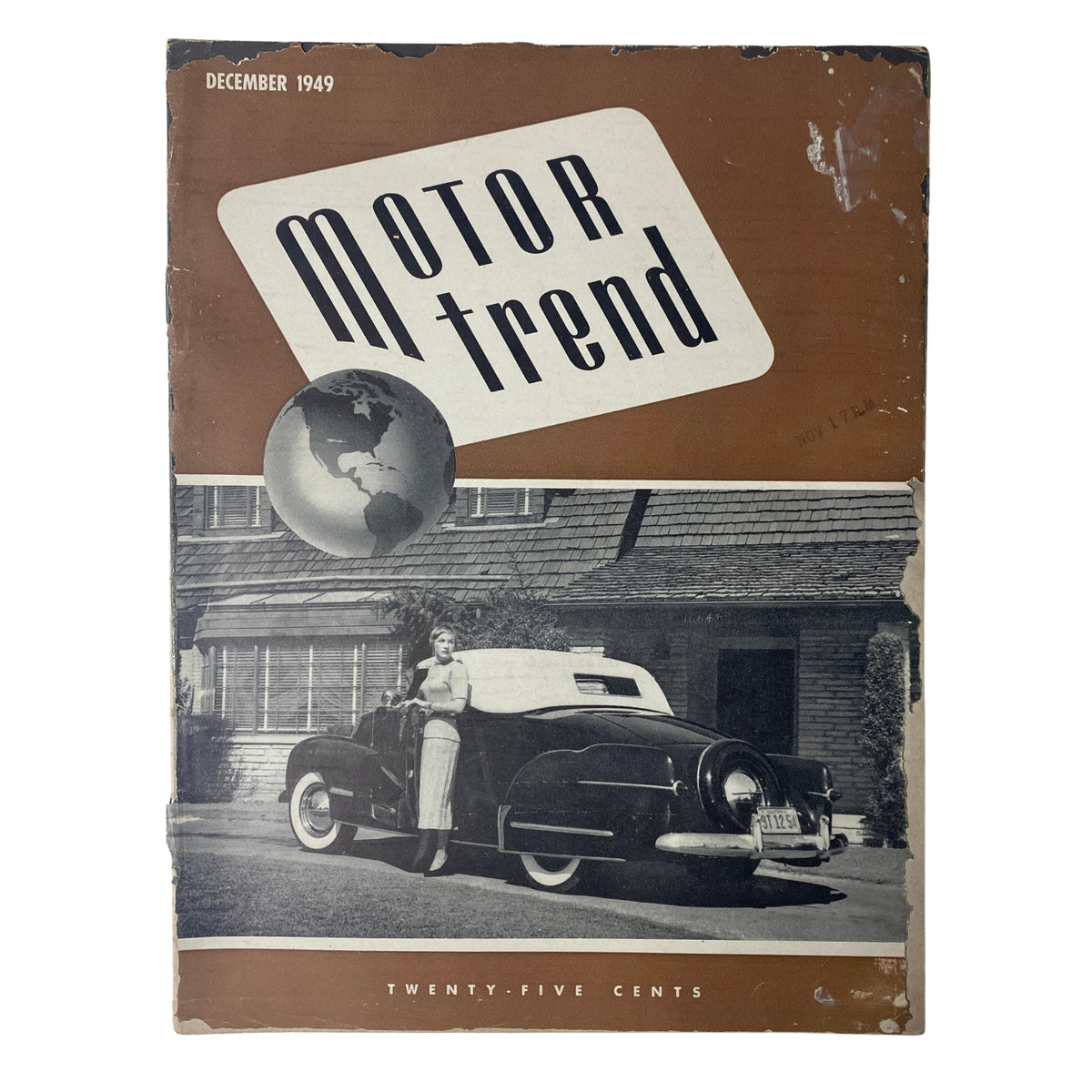Cover of Motor Trend Magazine December 1949 featuring the Topper Car, showcasing vintage automotive design and style, with a classic car parked in front of a house.
