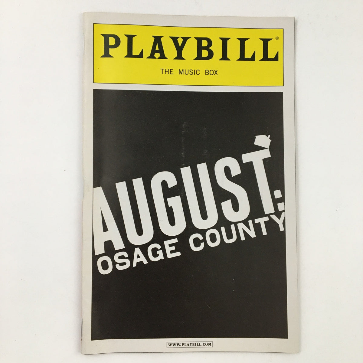 Cover of the Playbill titled 'August: Osage County' from The Music Box Theatre, featuring striking yellow and black design for the 2008 production.