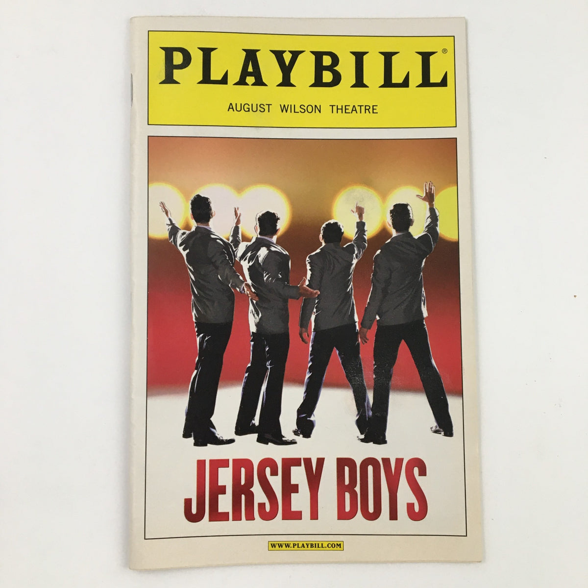 2008 Playbill for Jersey Boys at August Wilson Theatre, featuring four silhouetted performers with raised hands against a bright background, highlighting the iconic musical by Des McAnuff.