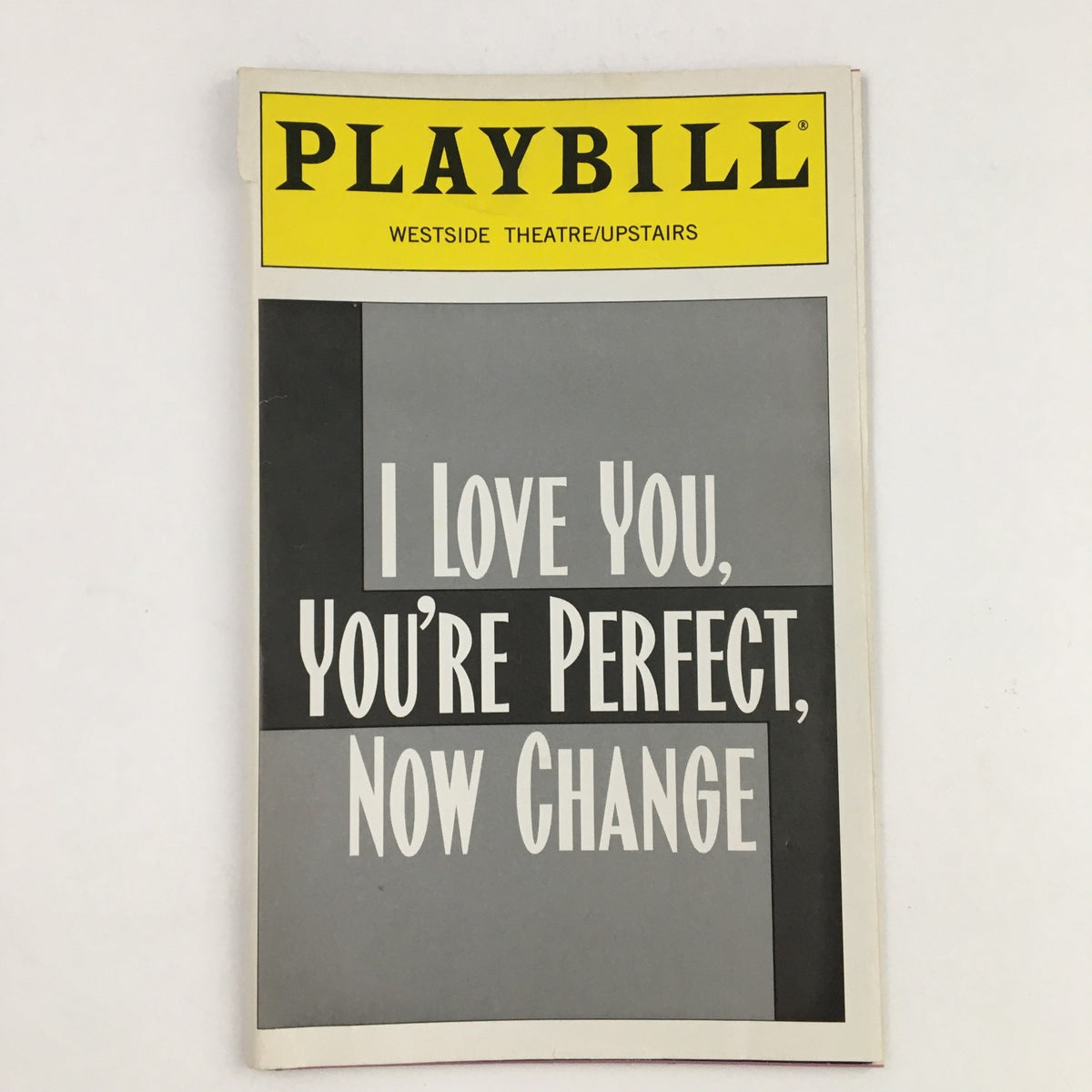 1996 Playbill for the musical 'I Love You, You're Perfect, Now Change' from the Westside Theater, featuring a clean, modern design with a yellow header and bold title, ideal for collectors of vintage theater memorabilia.