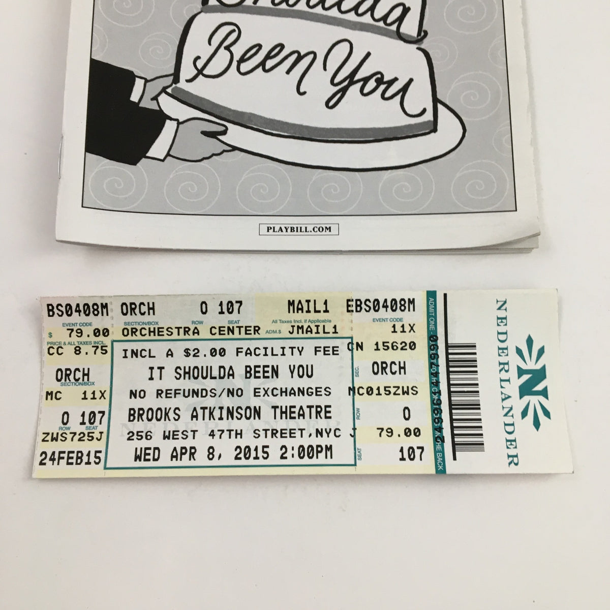 Close-up of the ticket stub for 'It Shoulda Been You' at Brooks Atkinson Theatre, dated April 8, 2015, reflecting the performance details.