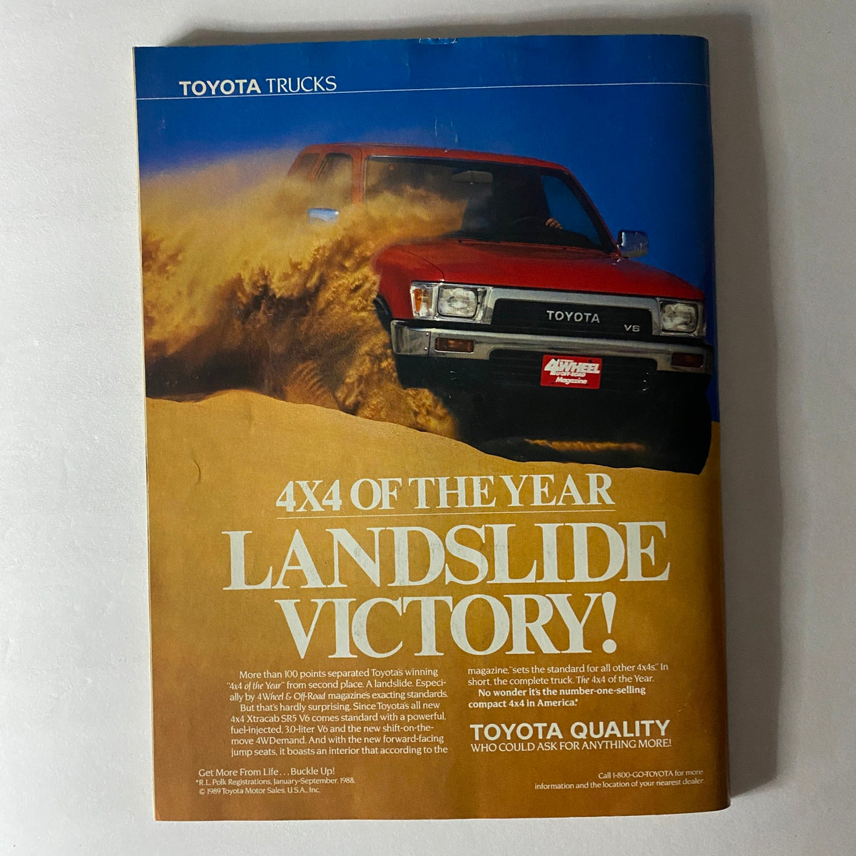 Advertisement from Petersen's 4-Wheel & Off-Road Magazine June 1989 promoting the Toyota Trucks 4x4 of the Year, highlighting their off-road capabilities.