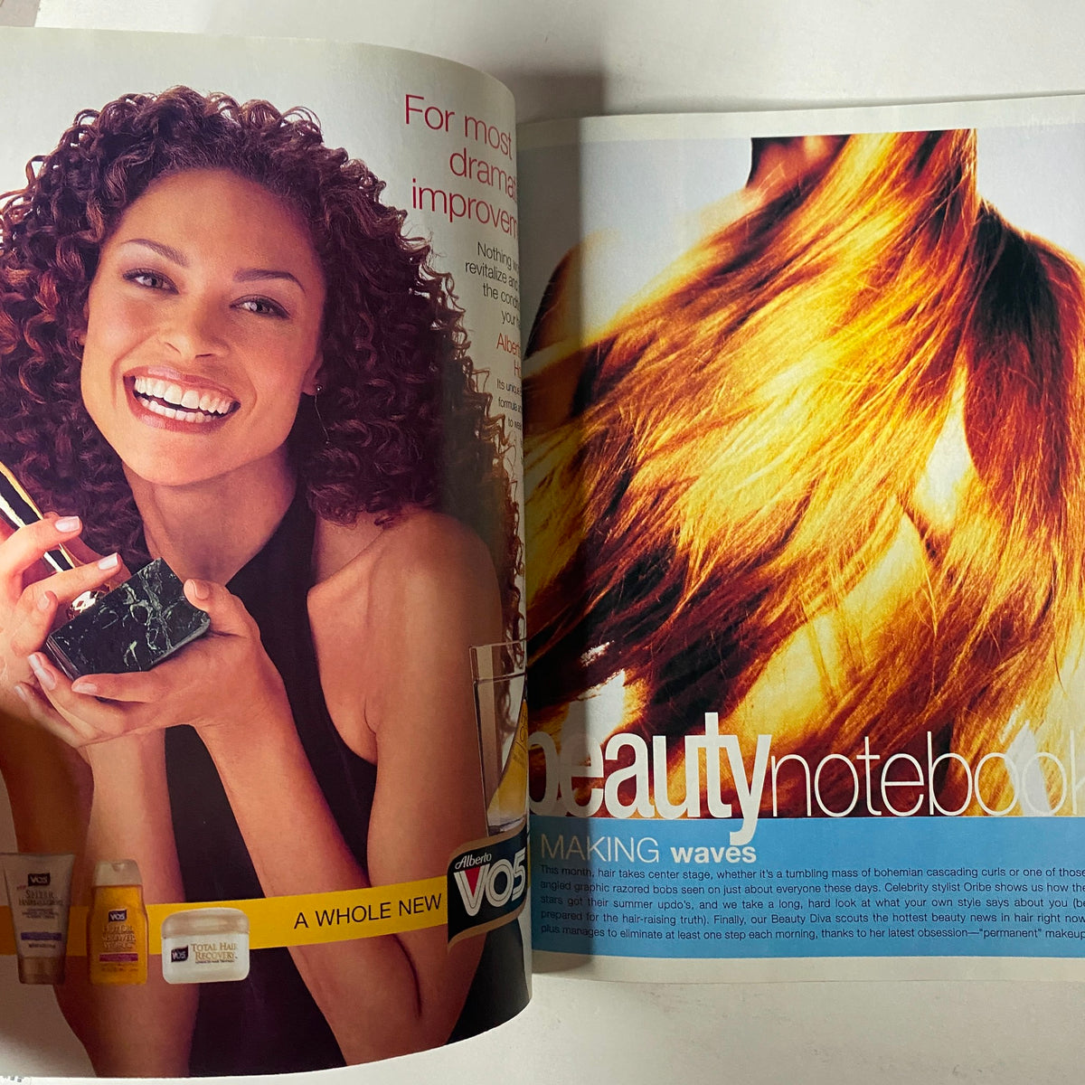Advertisement in Mode Magazine July 2001 showcasing beauty products, promoting hair styling tips and products.