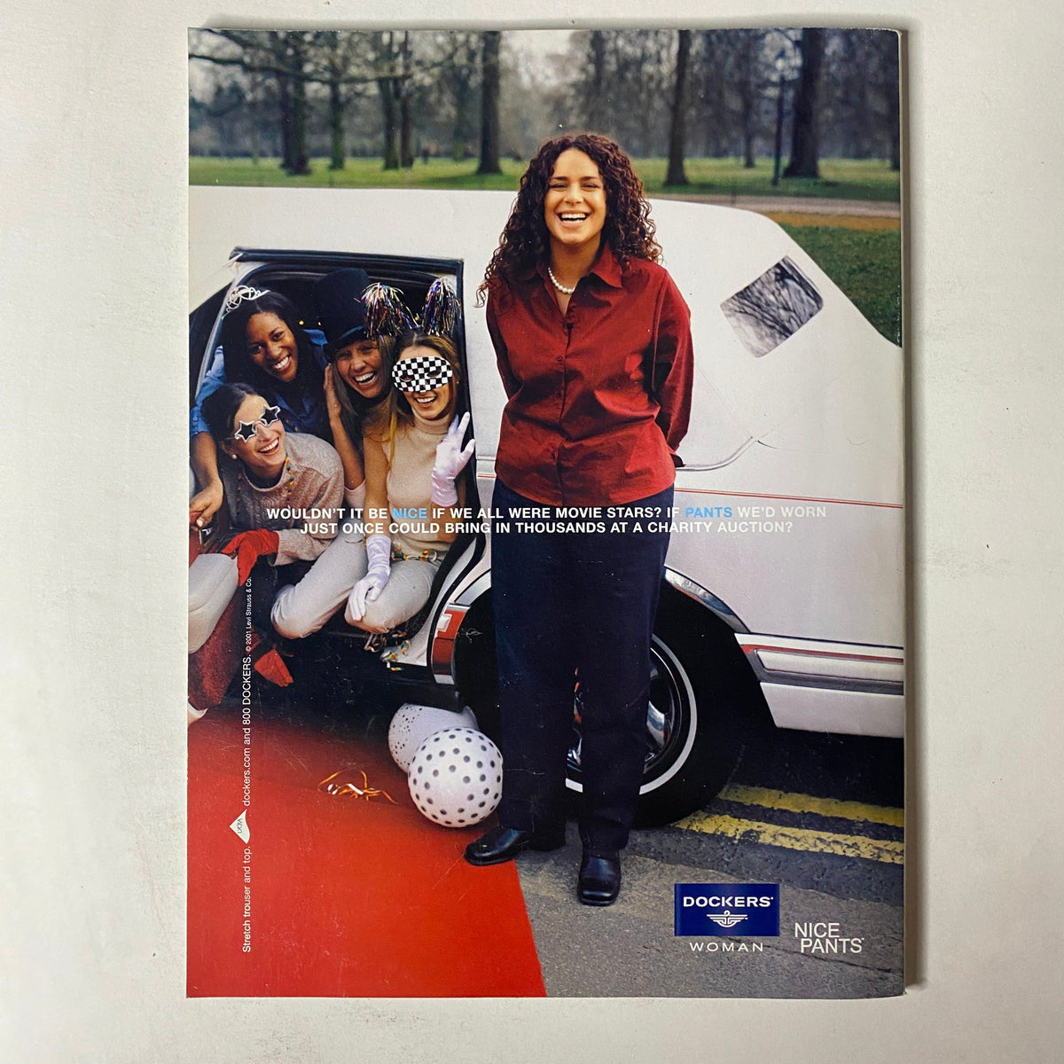 Promotional image for Dockers featuring diverse women enjoying a casual day out. The image incorporates the tagline 'Wouldn't it be nice if we all were movie stars?' and showcases stylish pants from the Mode Magazine October 2001 issue titled 'The New Bombshell Beauty'.