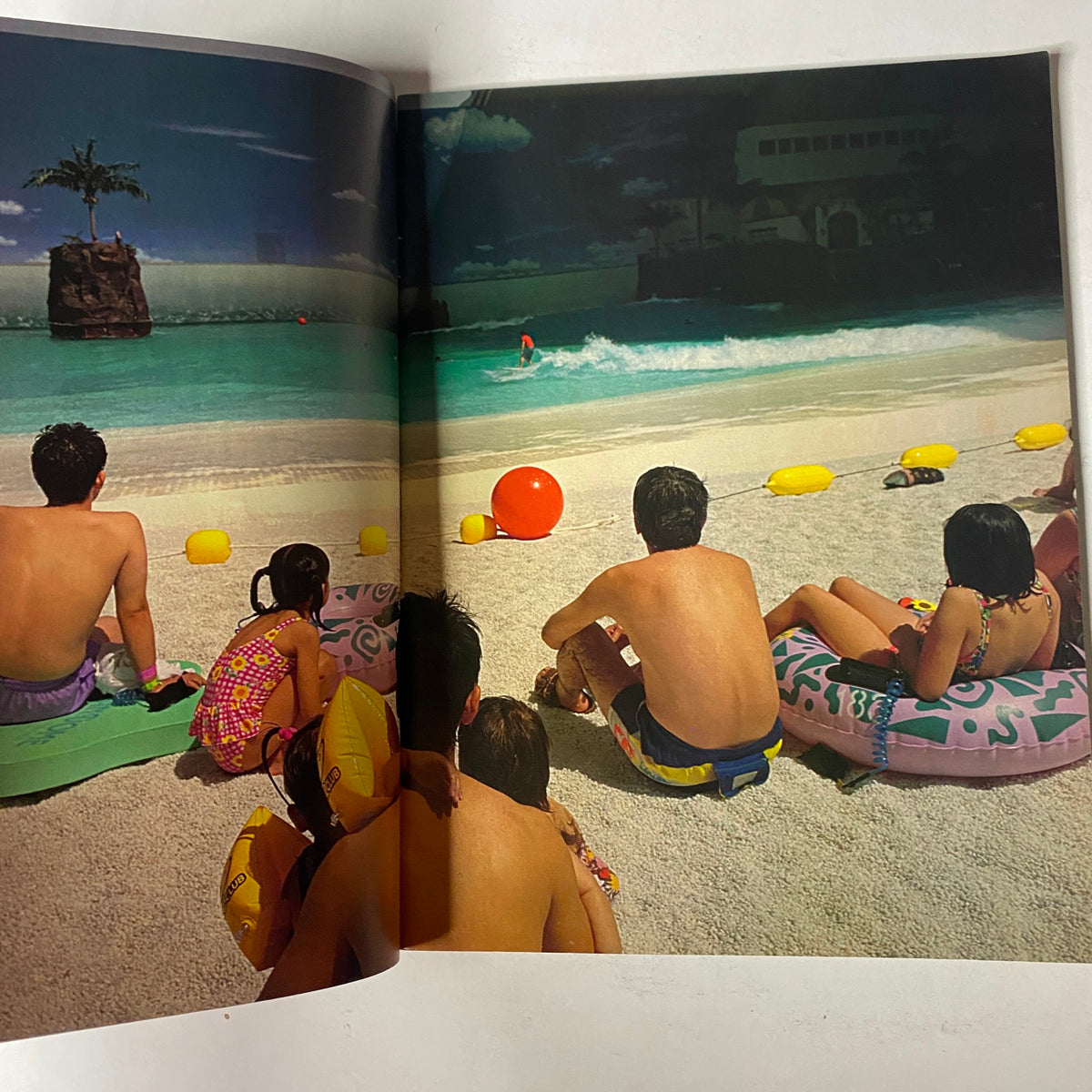 A spread from Radar Magazine Summer 2003 depicting a beach scene with people enjoying the sun, showcasing the lifestyle and culture of the early 2000s.