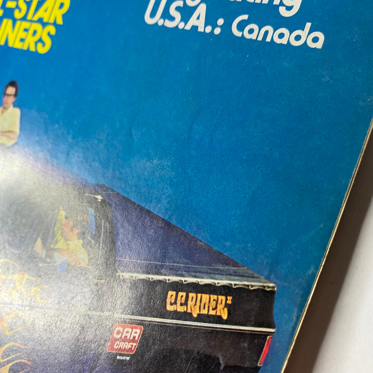 Close-up of Car Craft Magazine November 1973 showing the side view of CC Rider II Chopped GMC Pickup highlighting the vehicle's branding.